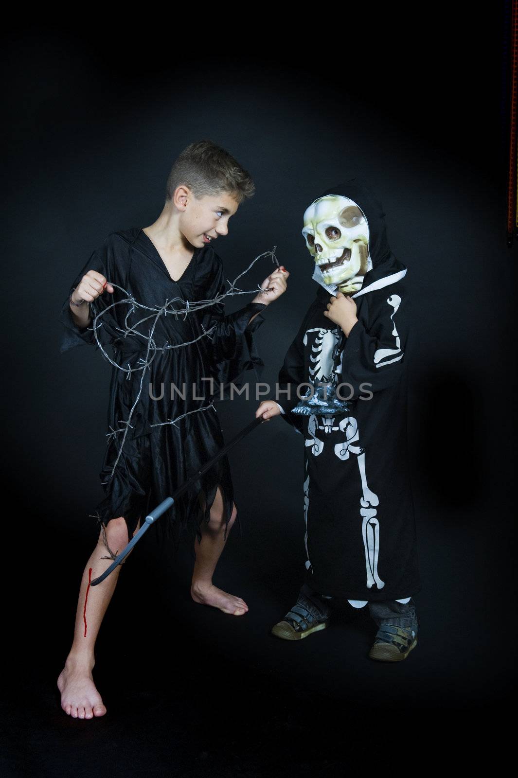 two children, dressed for halloween.