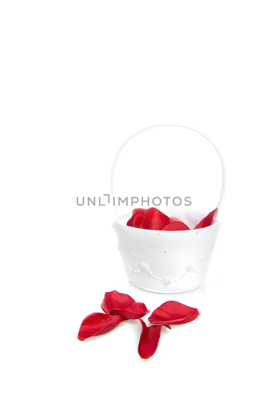 a white basket with rose leaves