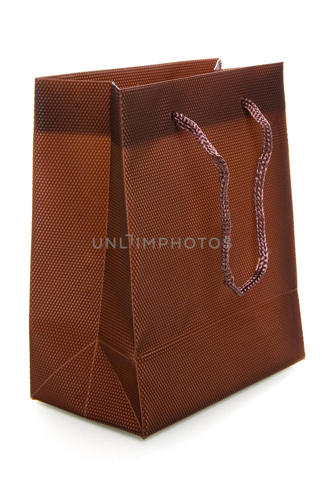 a chocolate-brownl bag on a white background