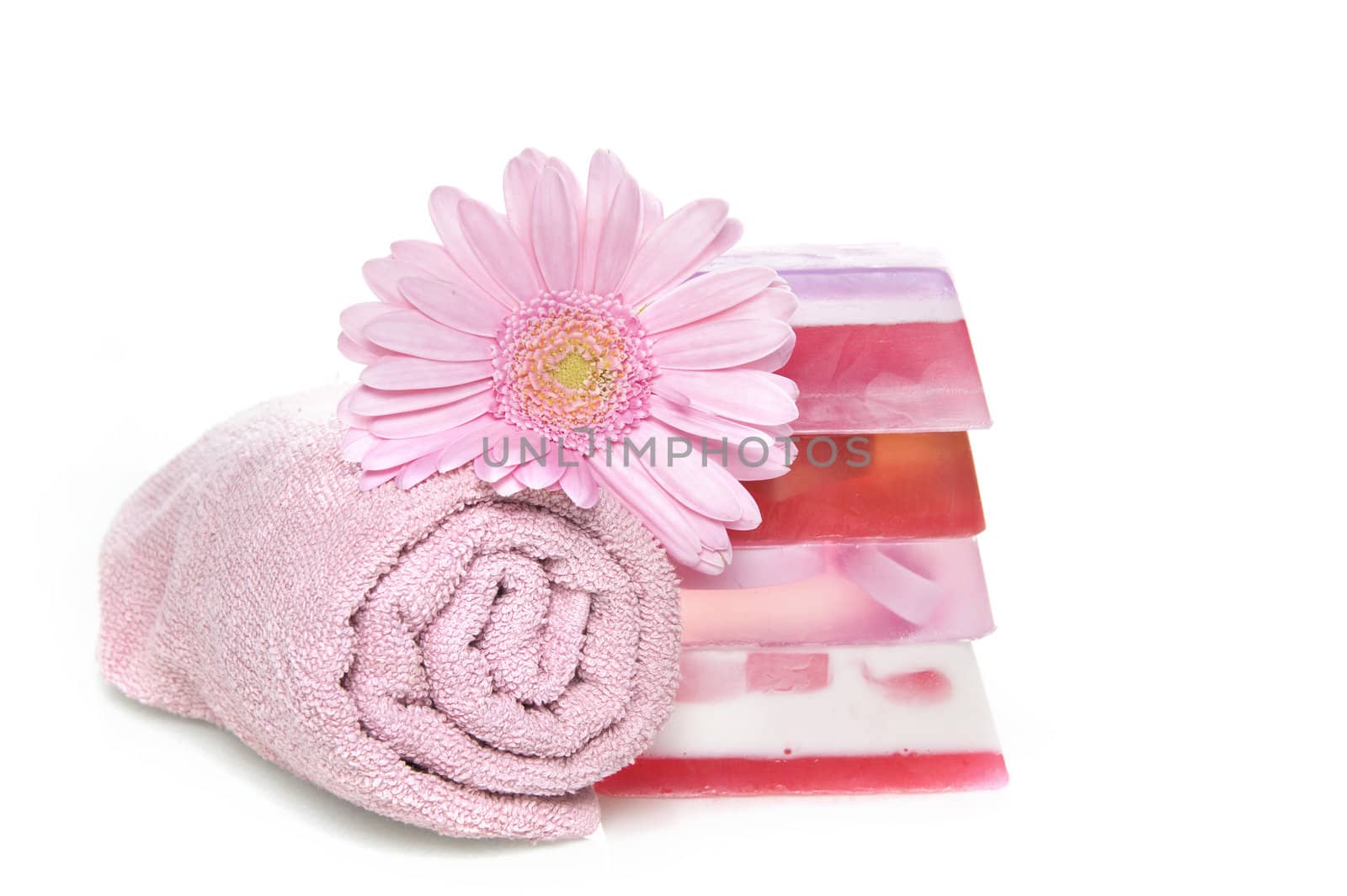 a towel with a pile of soap 