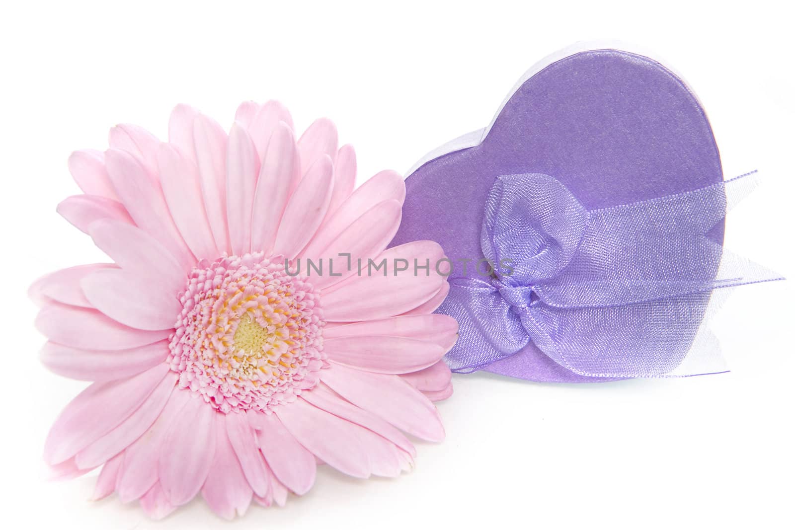 a purple heart box with a pink flower on a white background