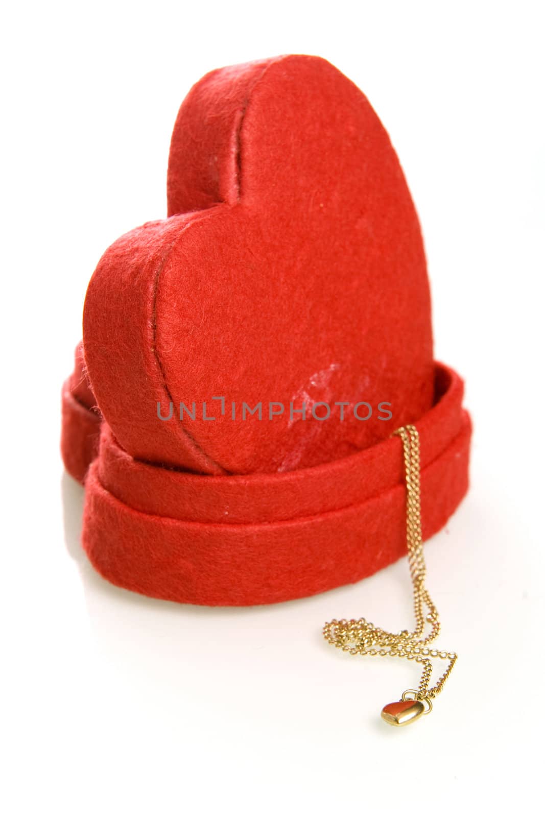 a red heart box with a golden heart on a white background