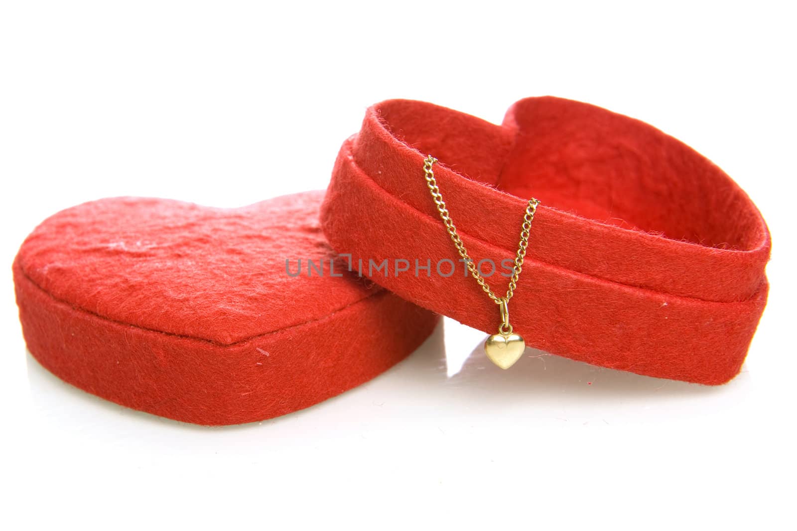 a red heart box with a goldon heart on a white background