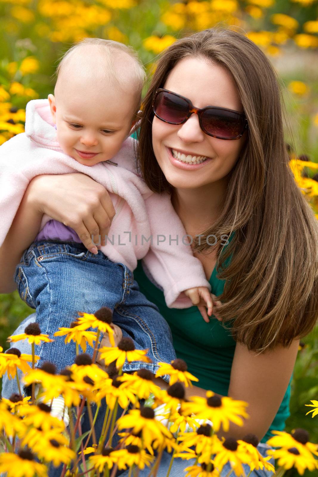 Mother and daughter in flowers