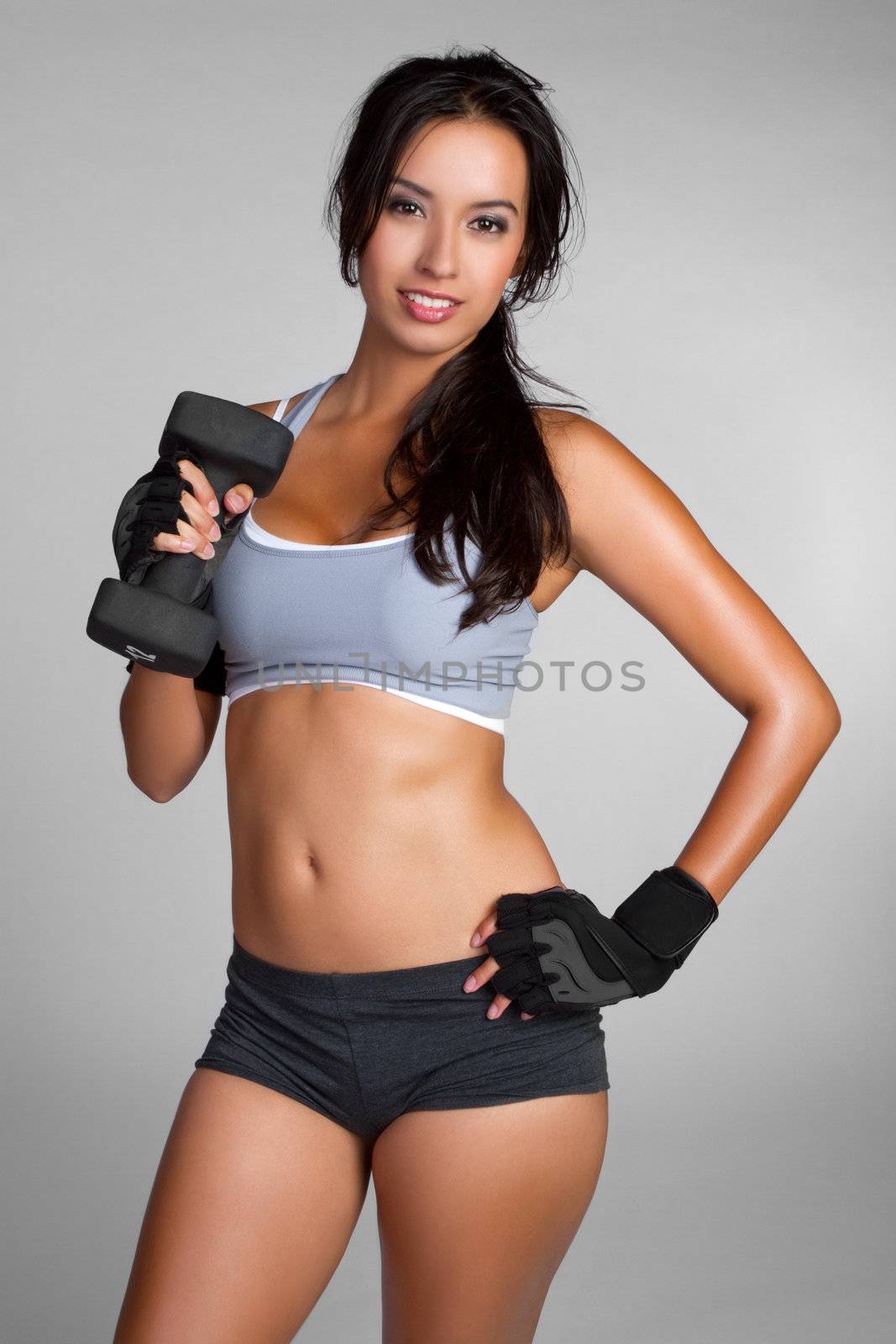 Hispanic fitness woman lifting weights