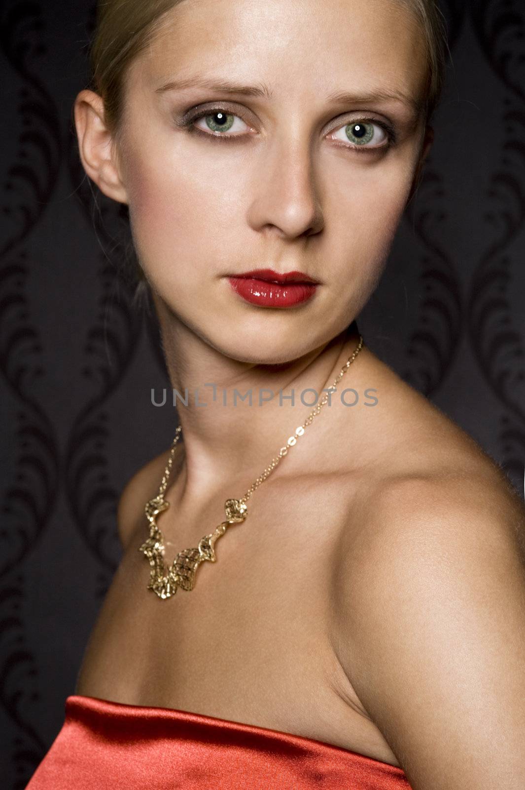 elegant woman wearing golden jewelry, over wallpaper background
