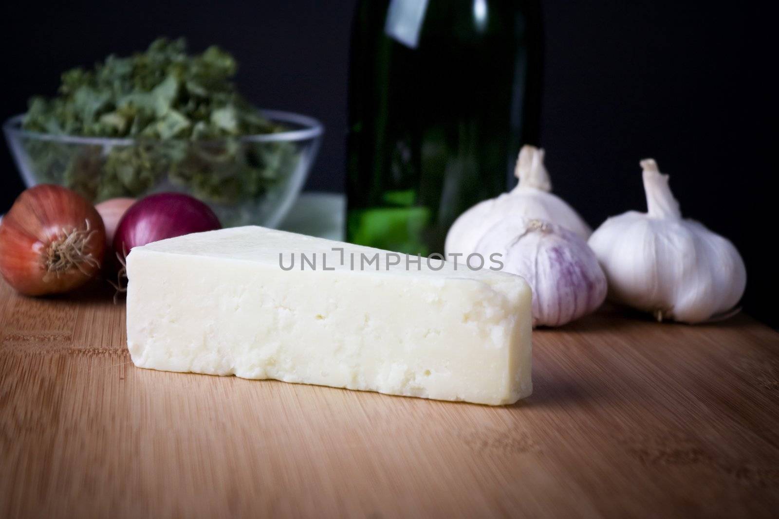 Block of fresh Italian Parmesan cheese.