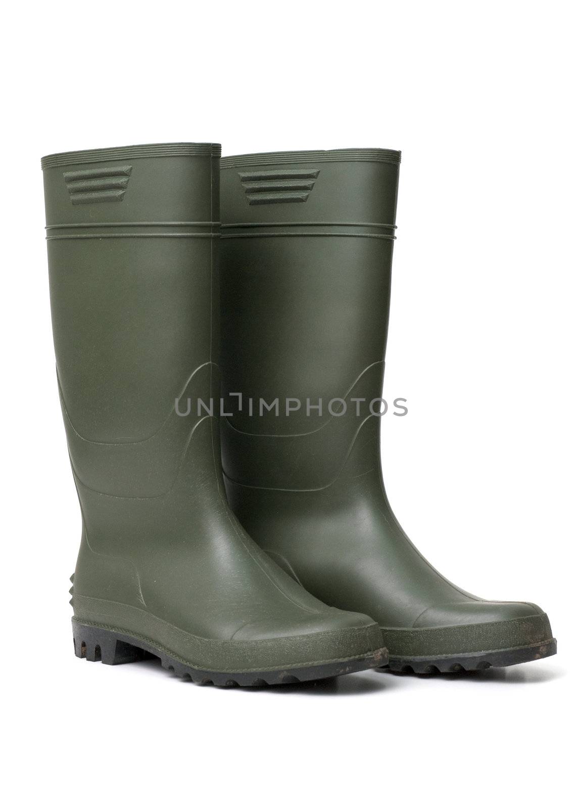 Green rubber boots isolated on white background.