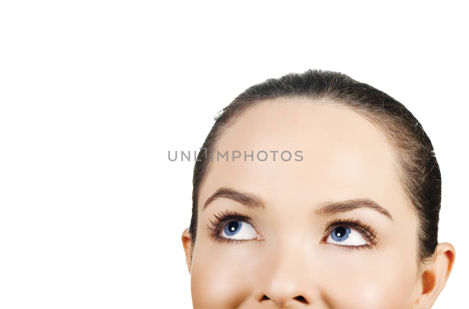Closeup portrait of a beautiful woman looking up at copyspace. Isolated on white background.