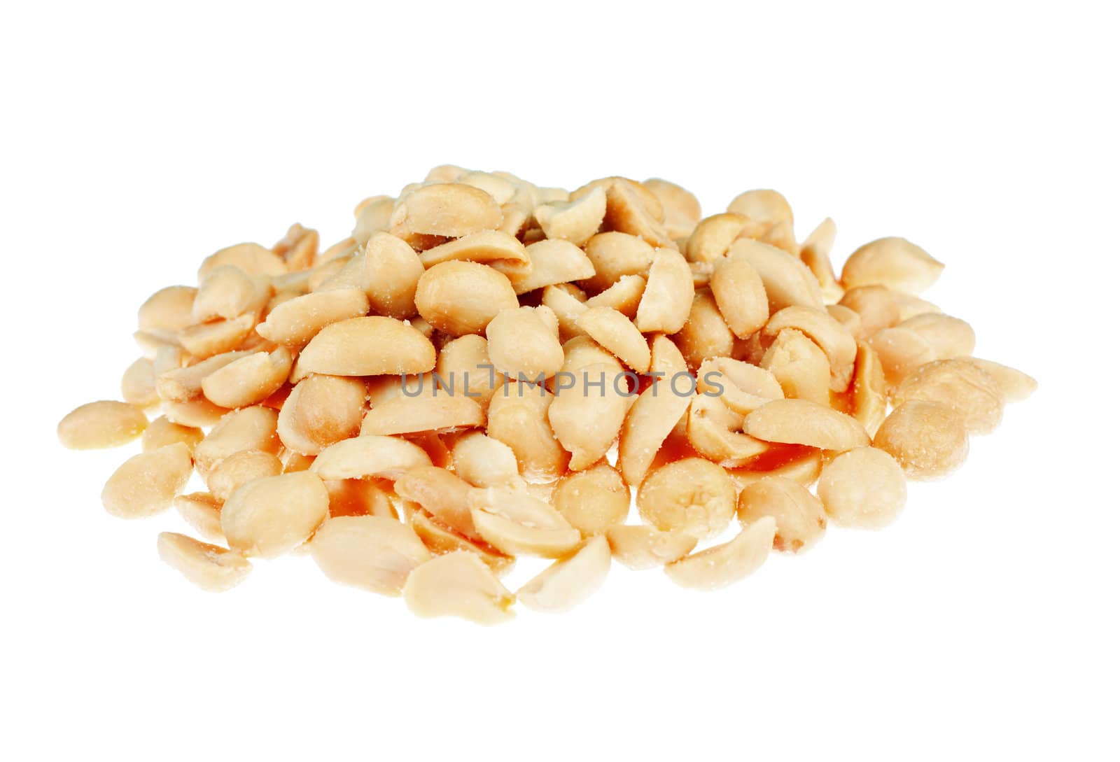 A delicious pile of salted roasted peanuts. Isolated over white