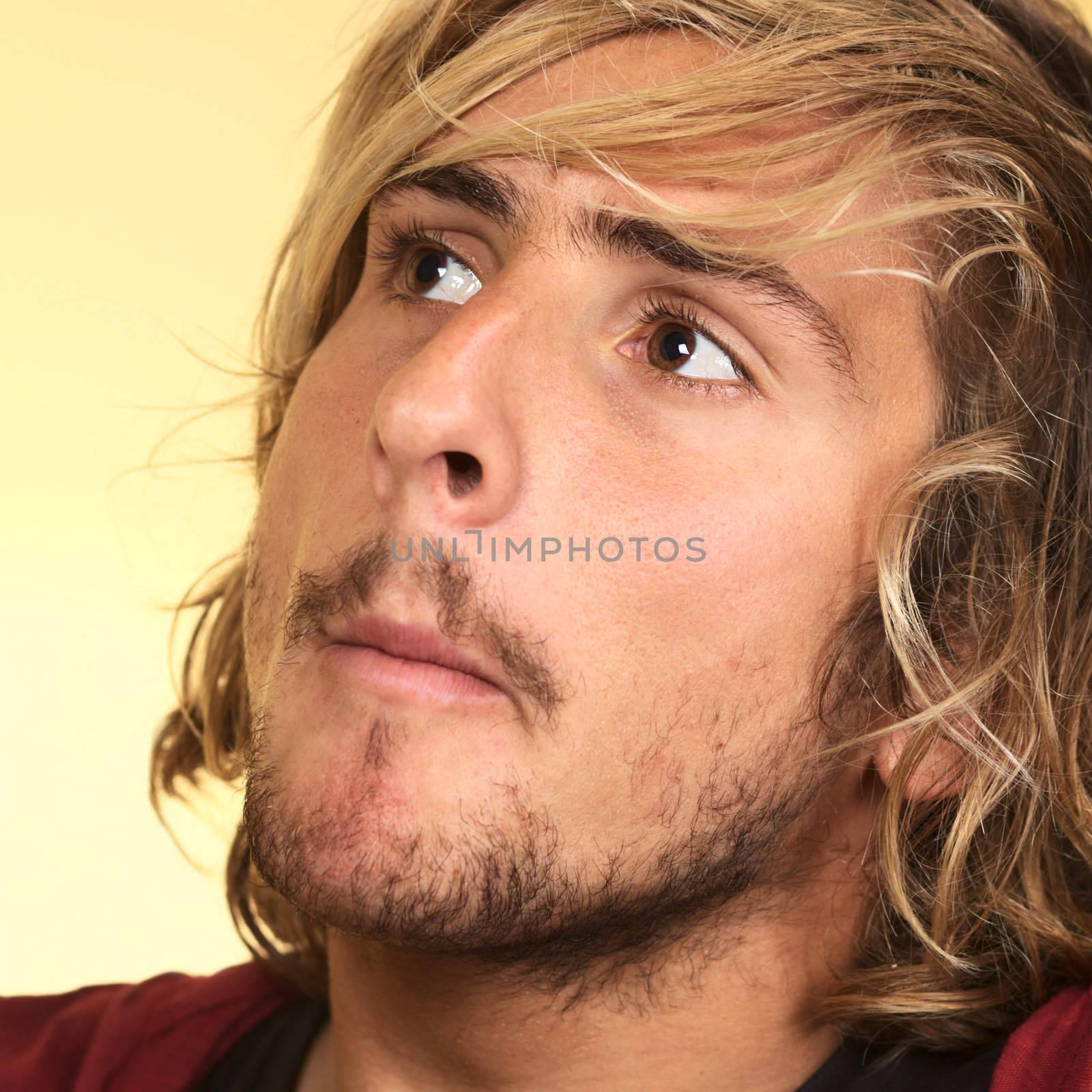 Young handsome Caucasian man (Selective Focus, Focus on the left eye)