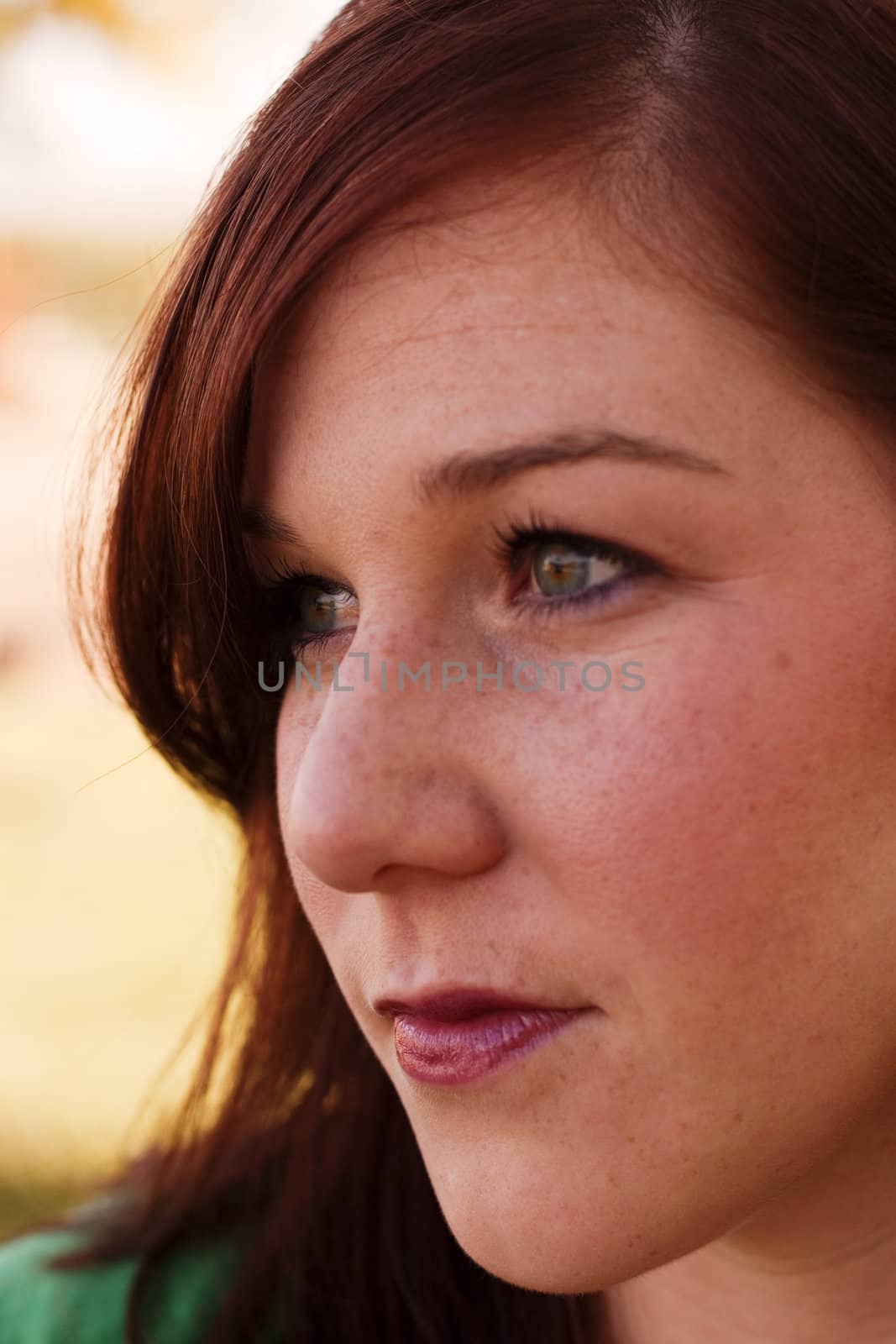 A portrait of a woman in her mid tweenties. 