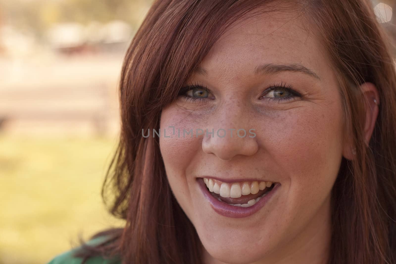 A portrait of a woman in her mid tweenties. 