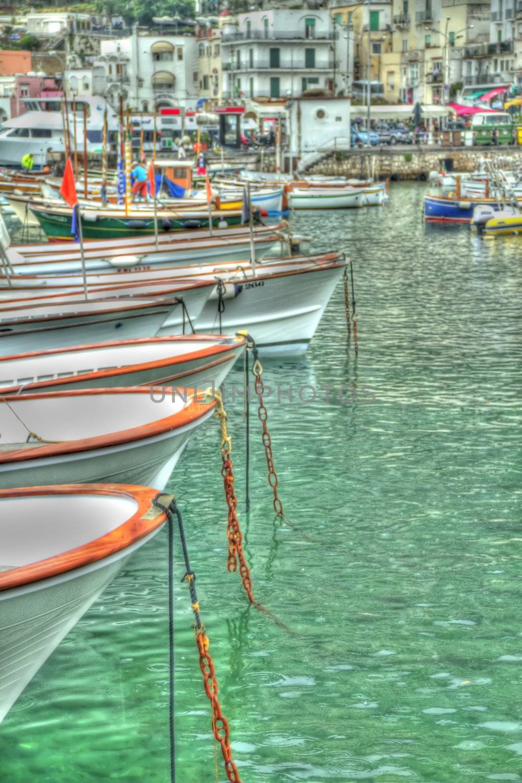 Images of the boats in the harbor of the Italian island of Capris, processed to appear is if they were painted.