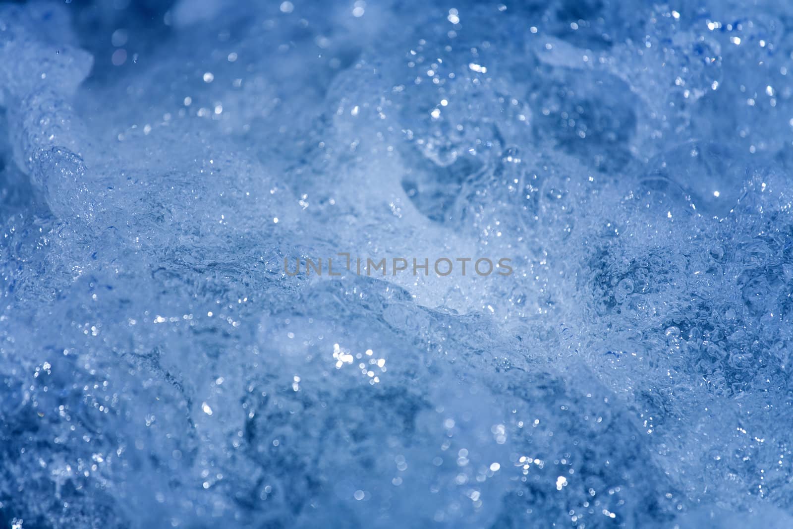 Blue water texture , close up photo