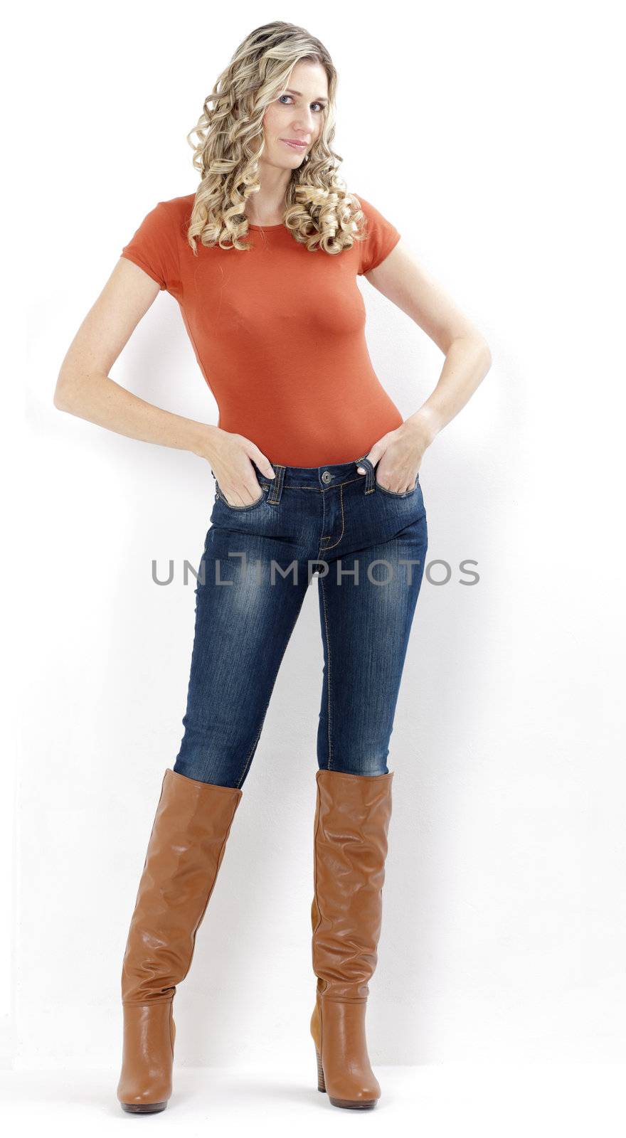 standing woman wearing fashionable brown boots by phbcz