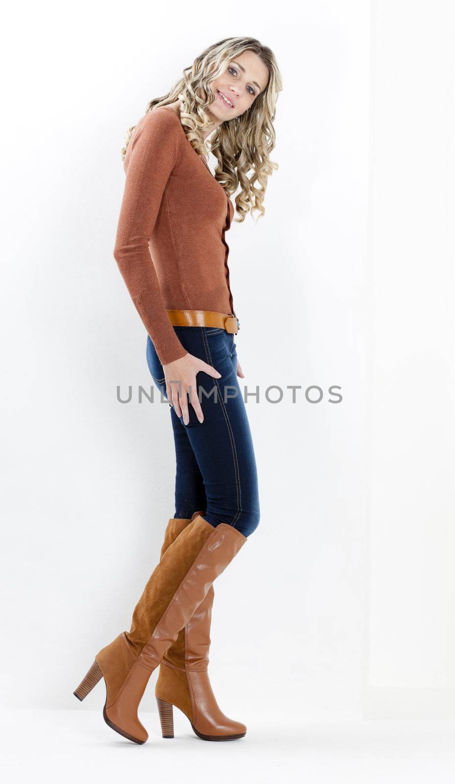 standing woman wearing fashionable brown boots