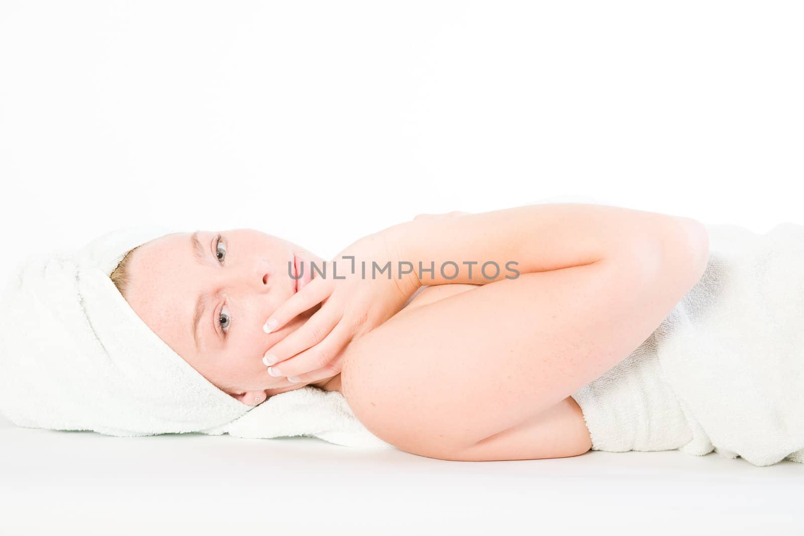 Studio portrait of a spa girl touching her face