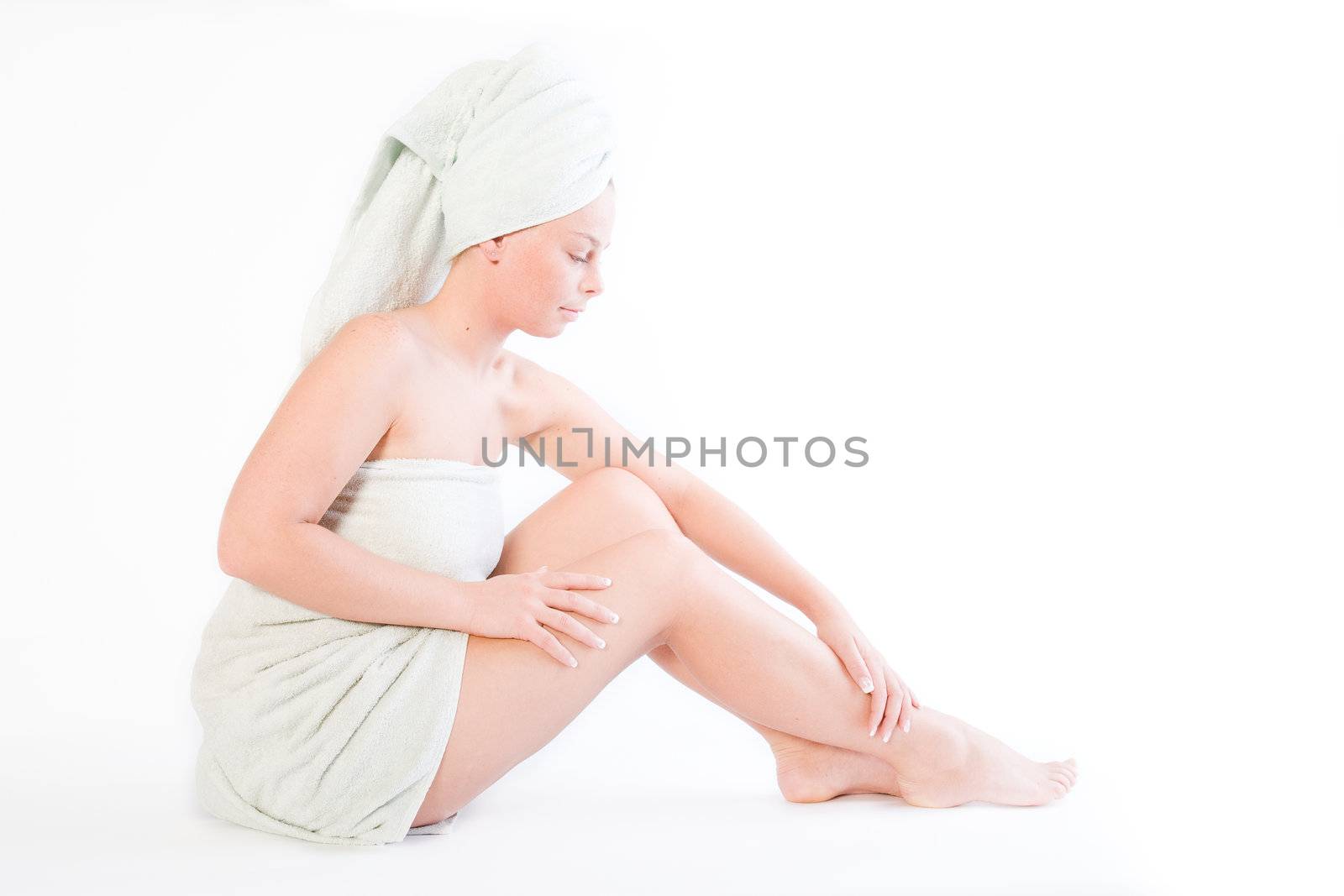 Studio portrait of a spa girl feeling her leg
