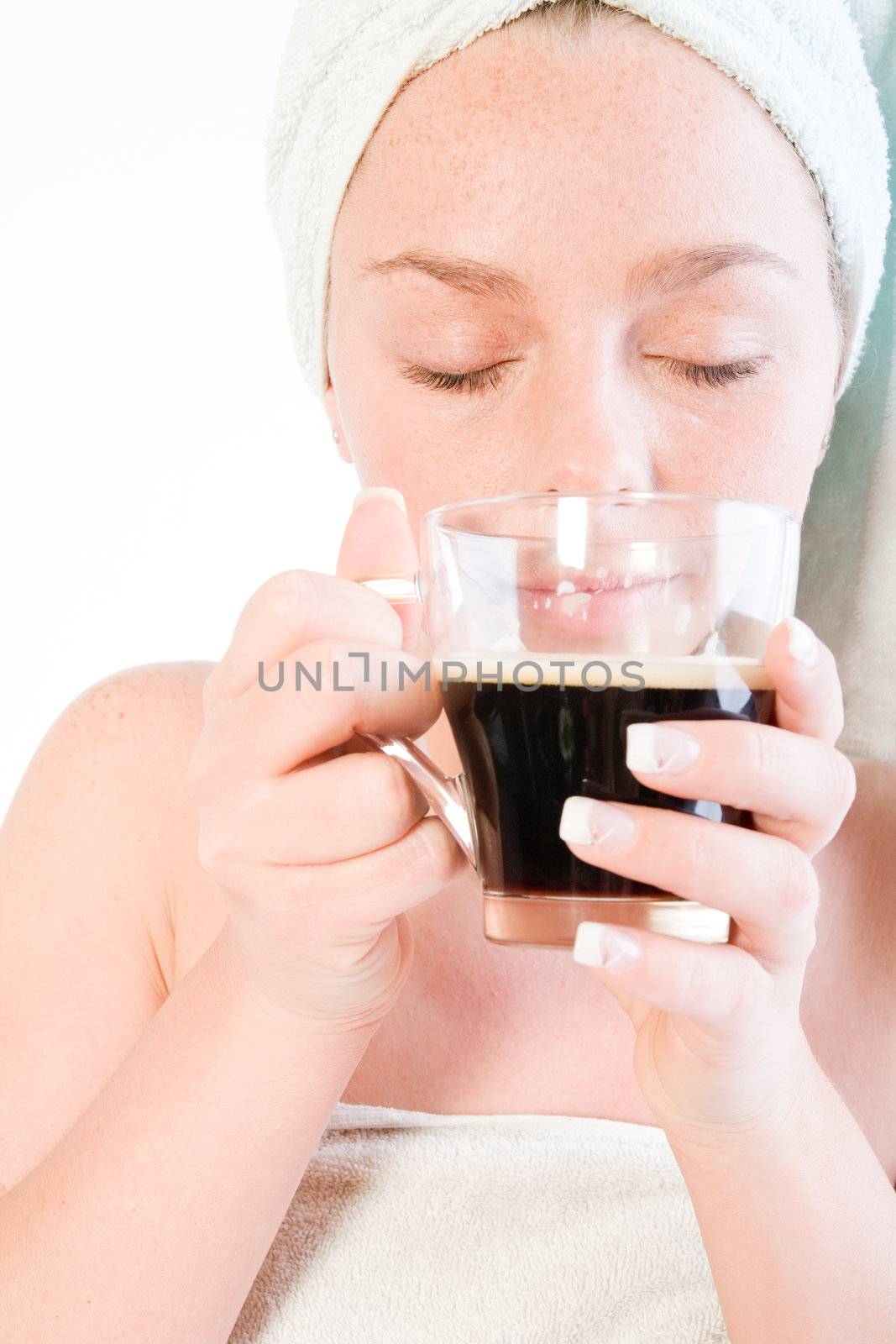 Studio portrait of a spa girl enjoying her coffee