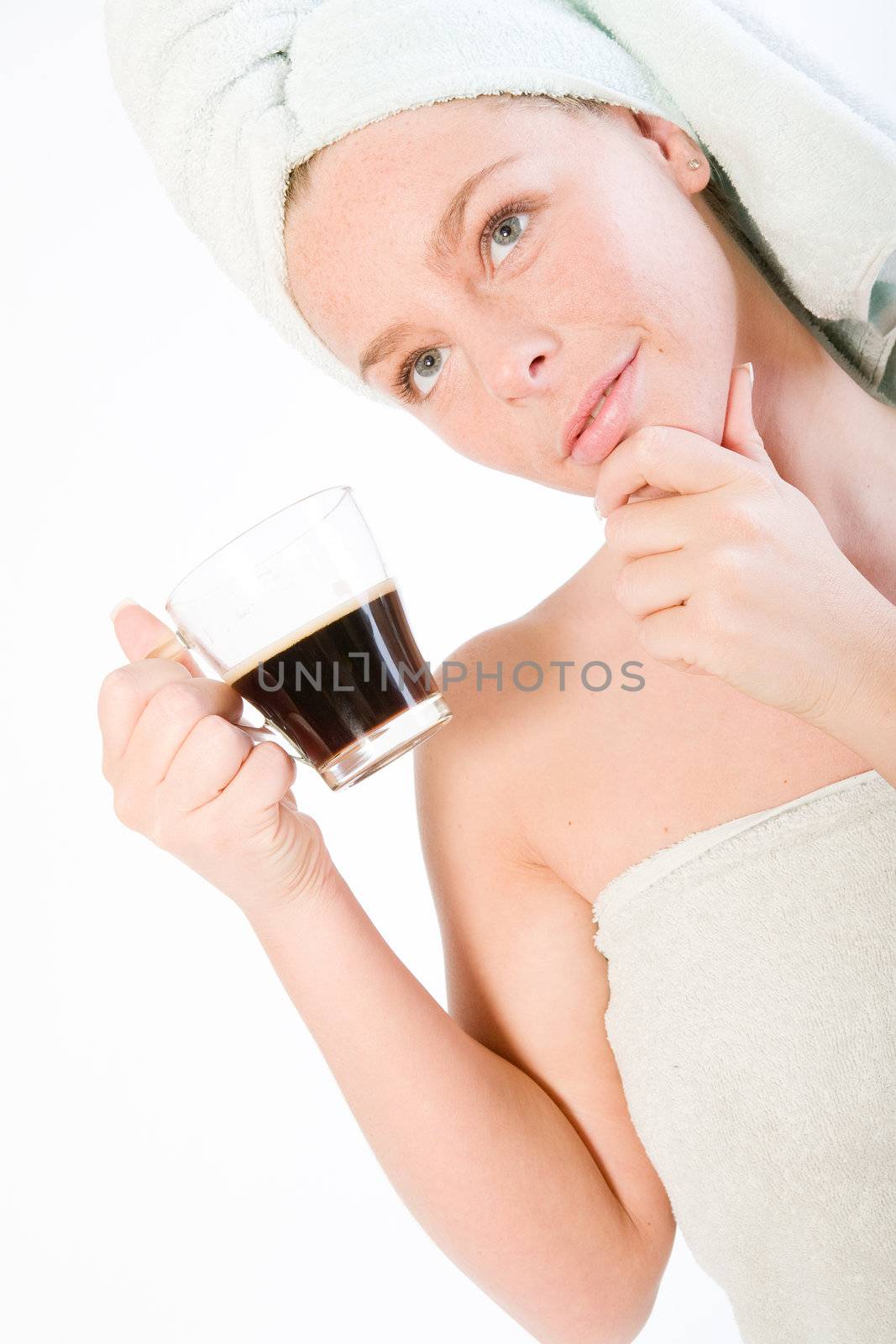 Studio portrait of a spa girl drinking coffee and thinking