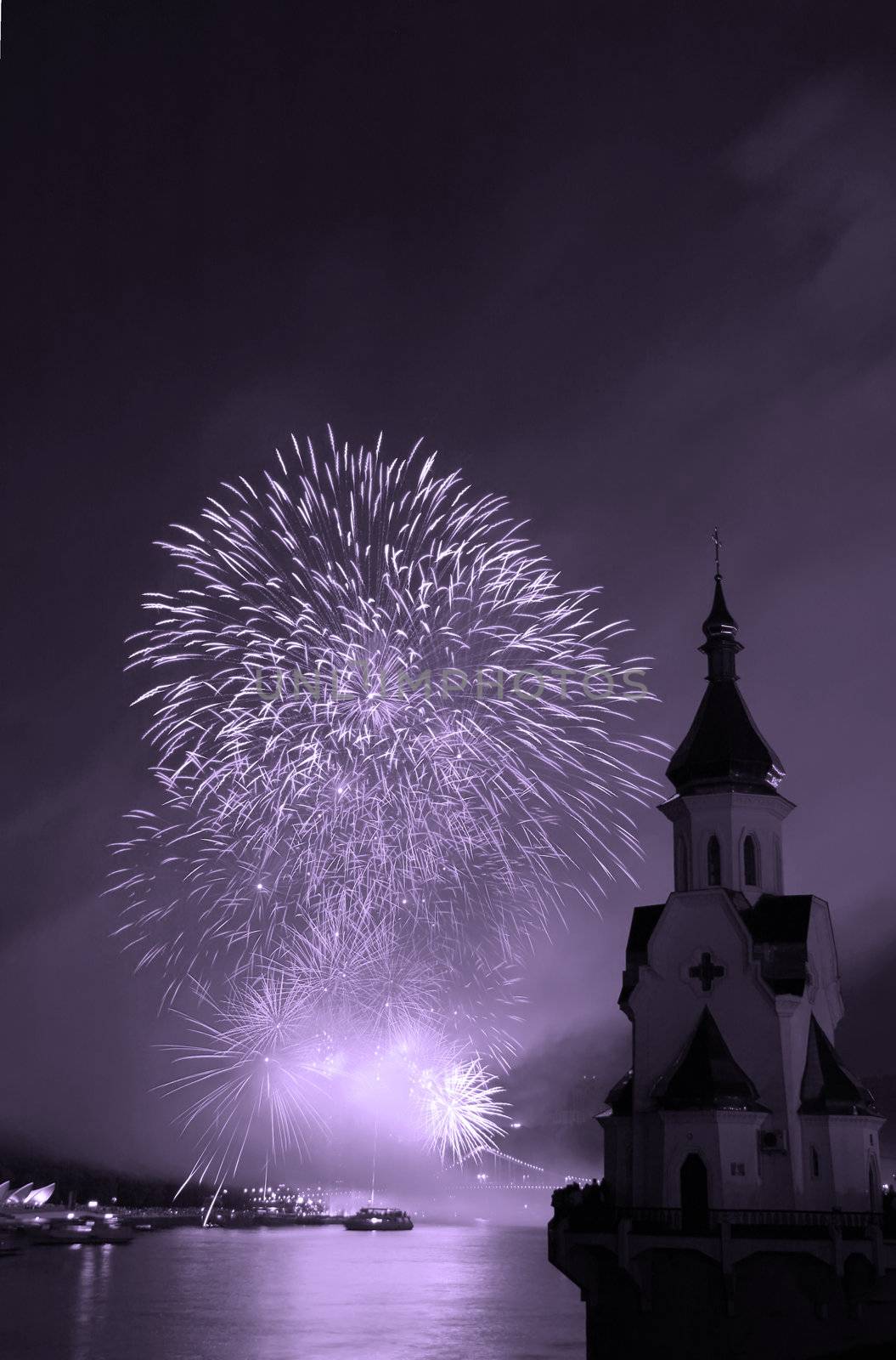 Firework festival on river Dniepr, Kiev, Ukraine. Black white photo with violet filter.