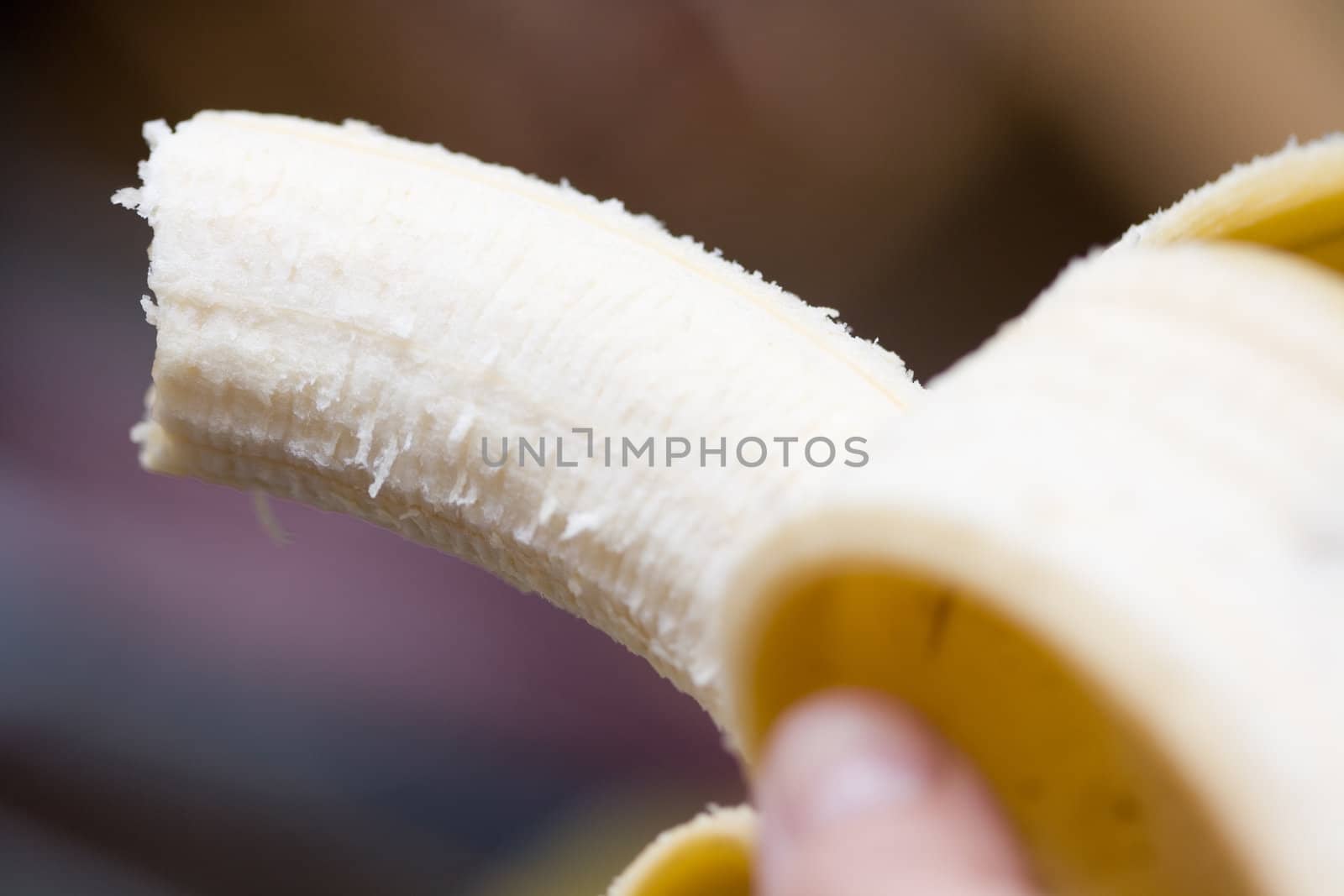 ripe opened banana on abstract backgroung