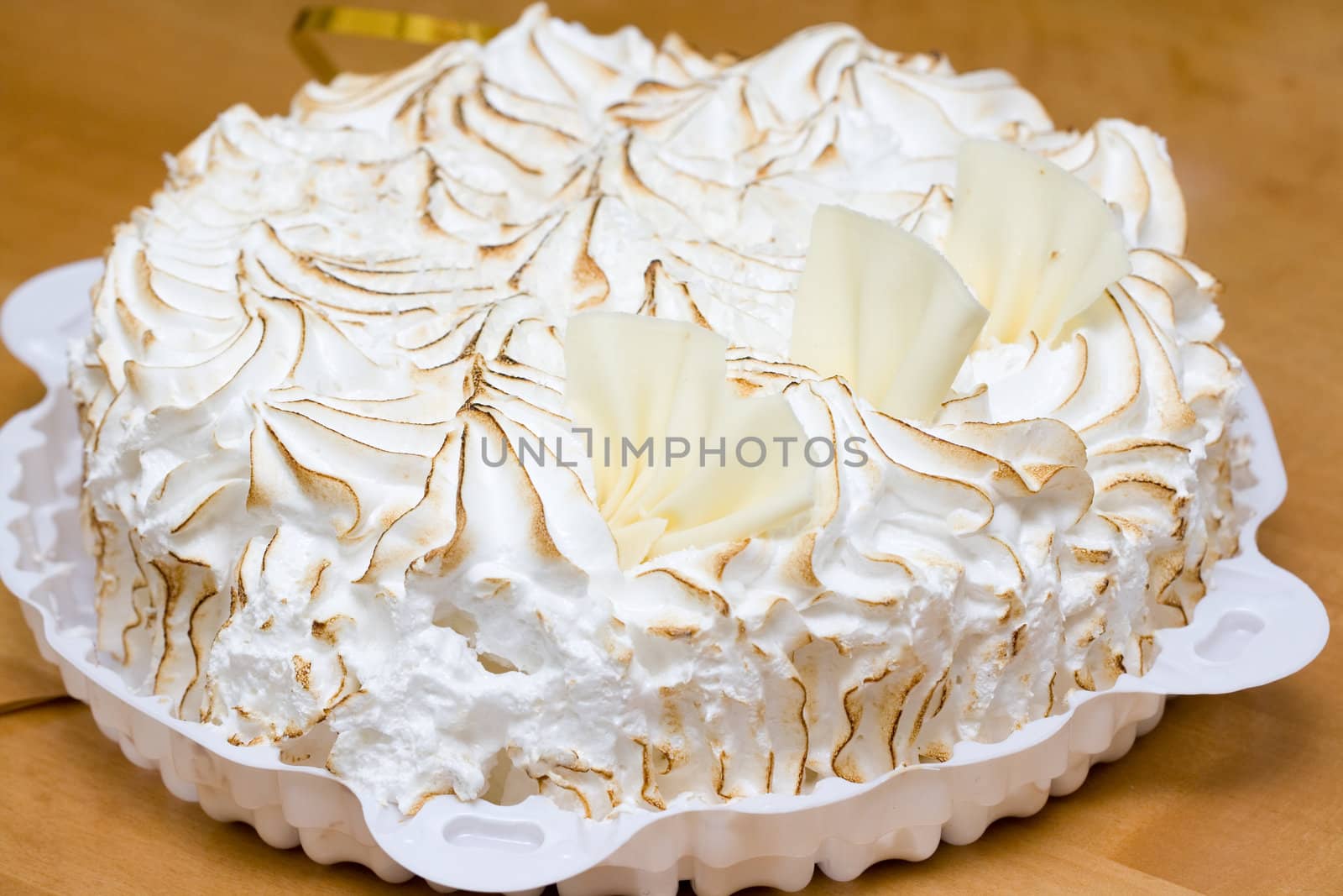 fresh meringue cake on the wooden table