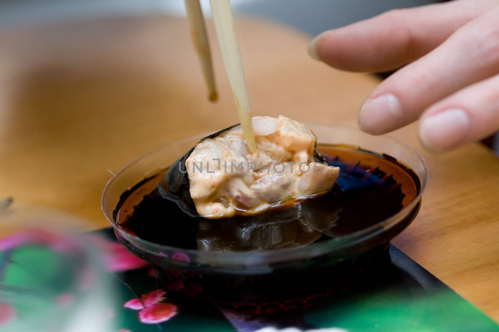 taking sushi with pecten (mollusc)