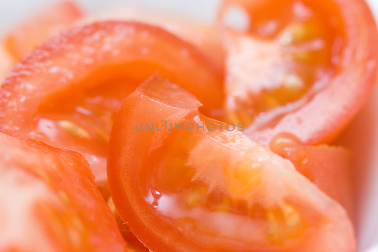 pieces of cutted tomato cloes up