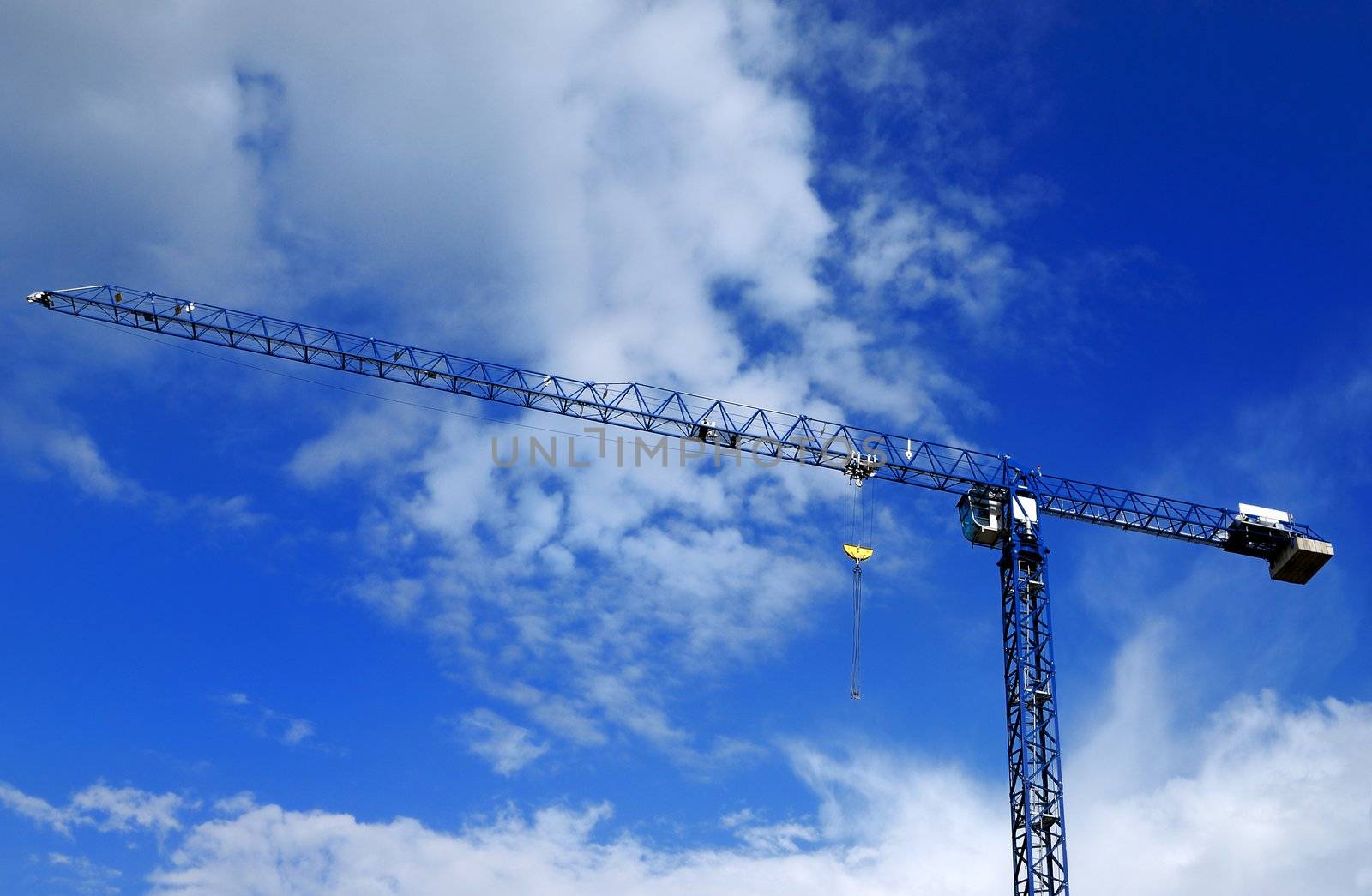 Blue metall tower crane in sky
