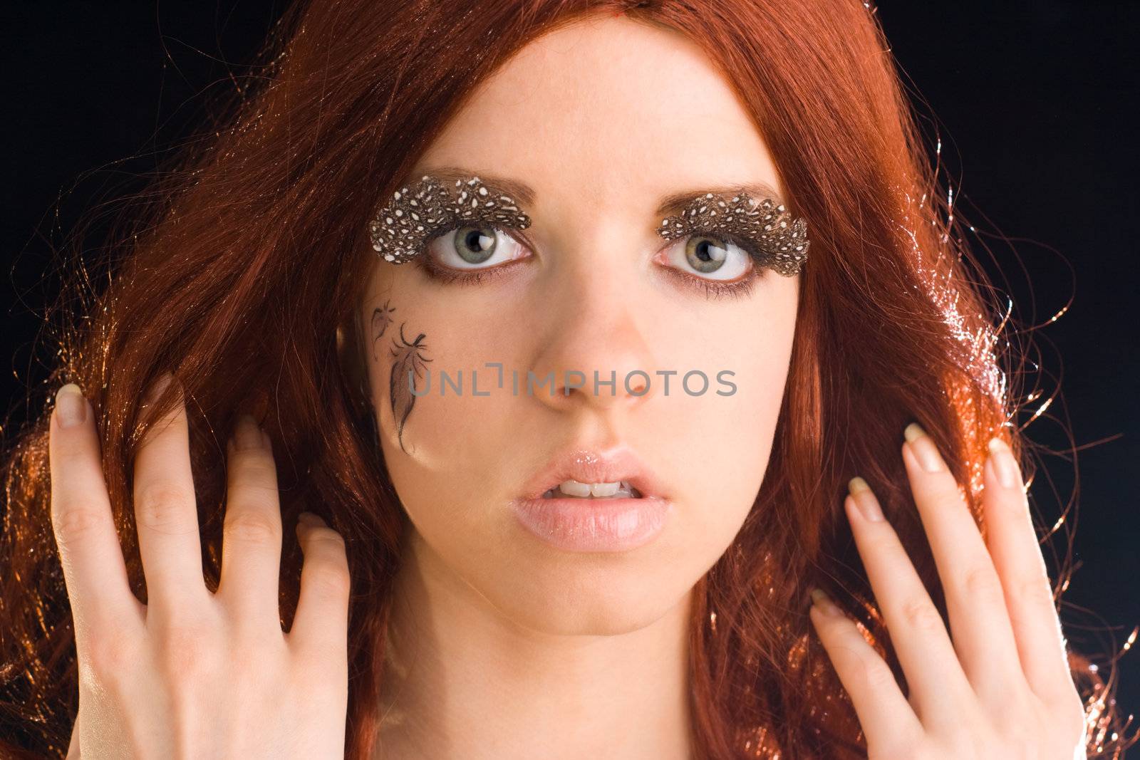 Contrast portrait of young woman in red wig