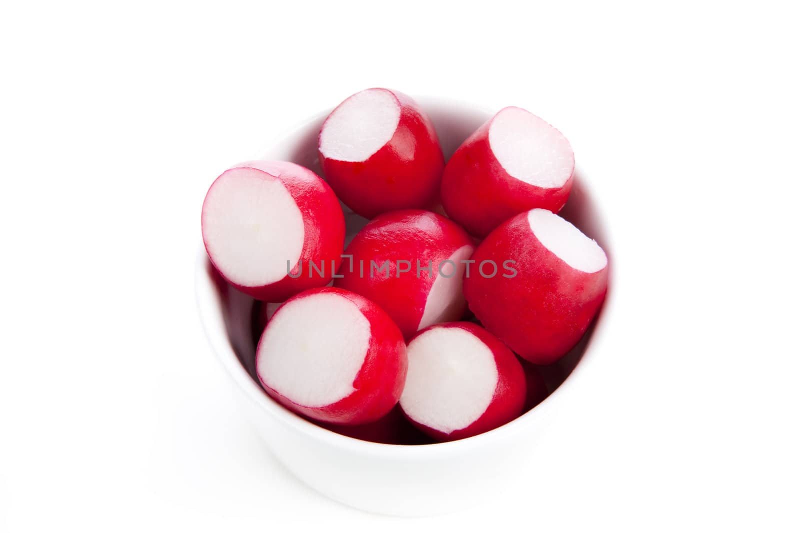 Fresh radishes in small bowl isolated on white.