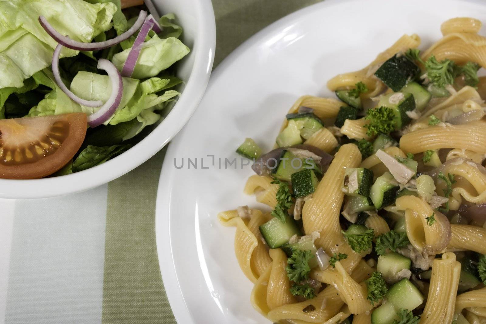 Gigli pasta with fish and zucchini and side salad