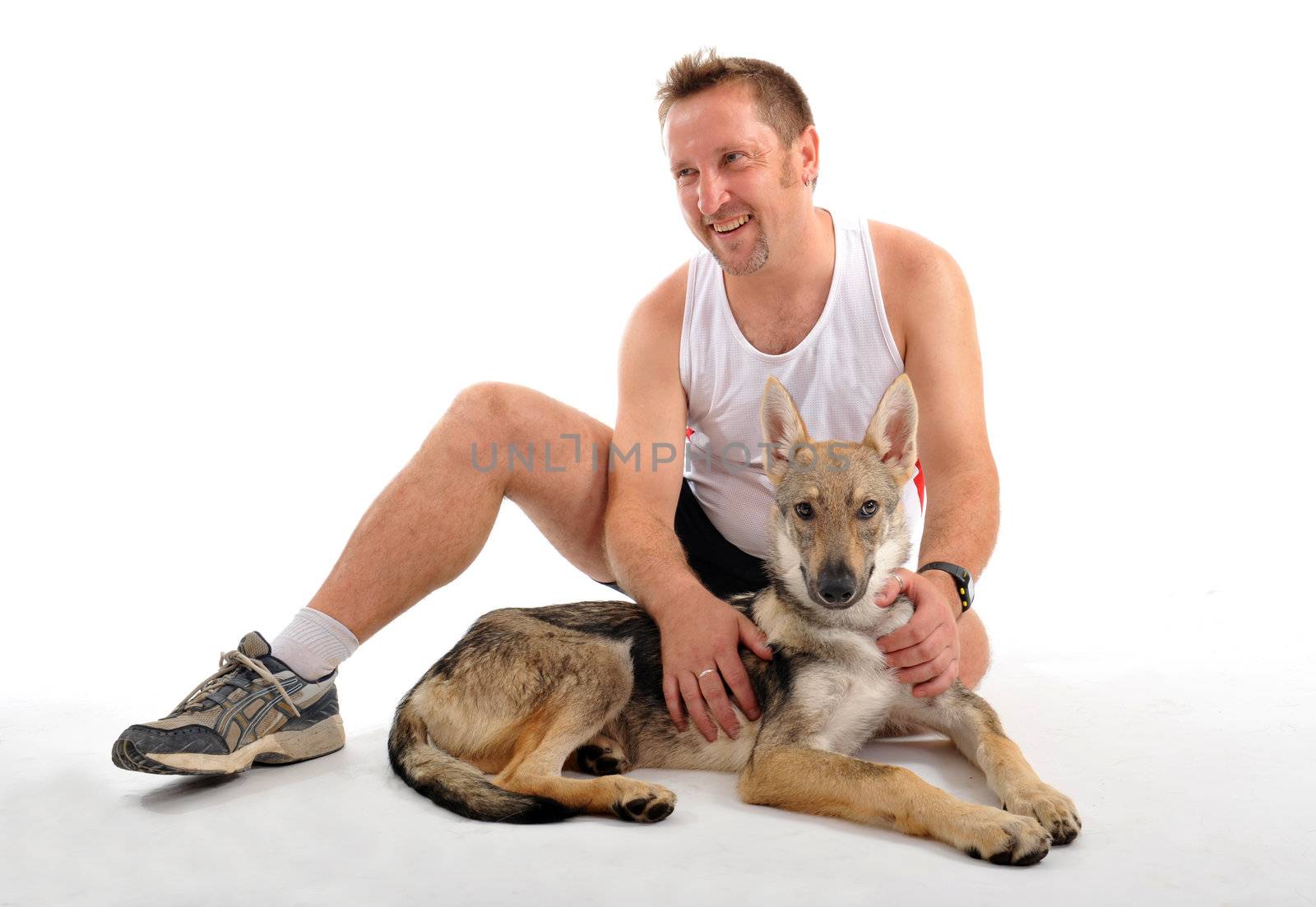 portrait of a man resting after sport training with his puppy
