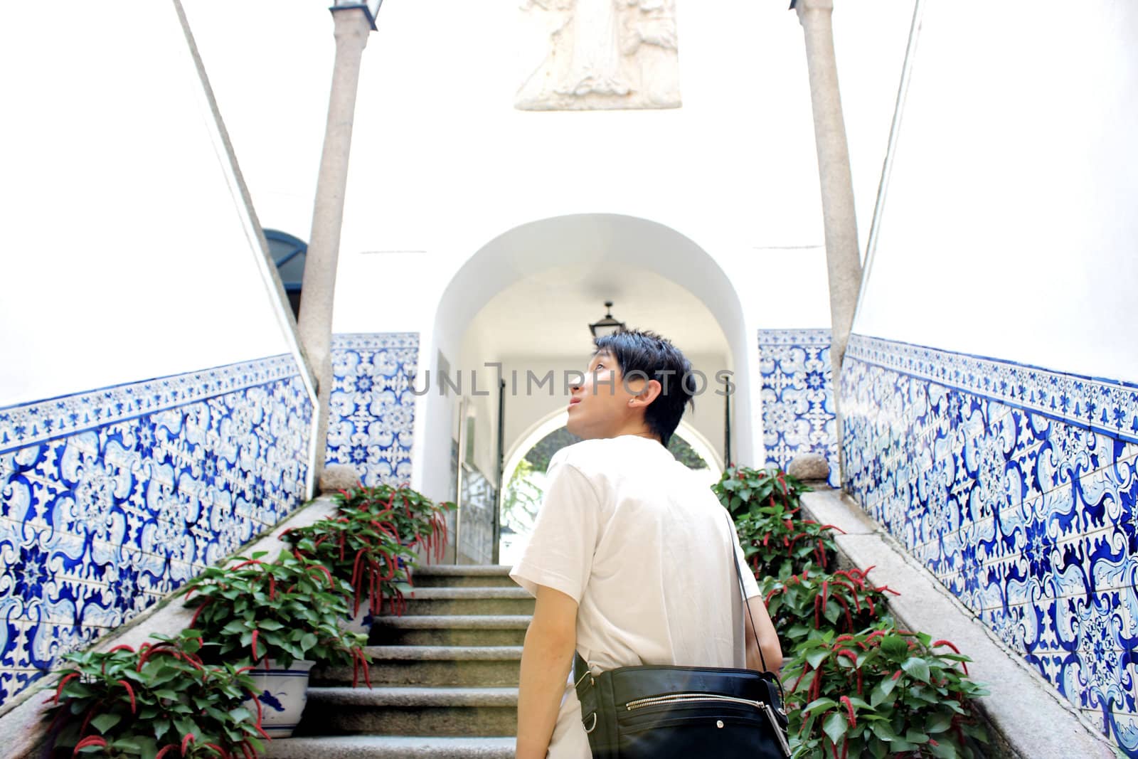 asia man walking to church stair at day