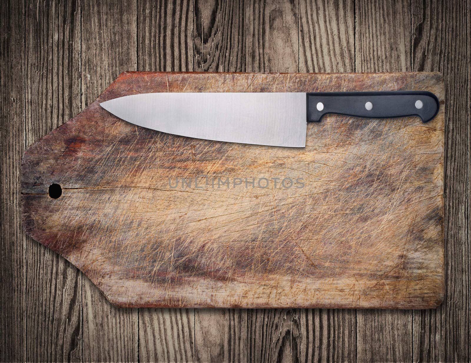 Kitchen knife on wooden cutting table, copy space, clipping path.