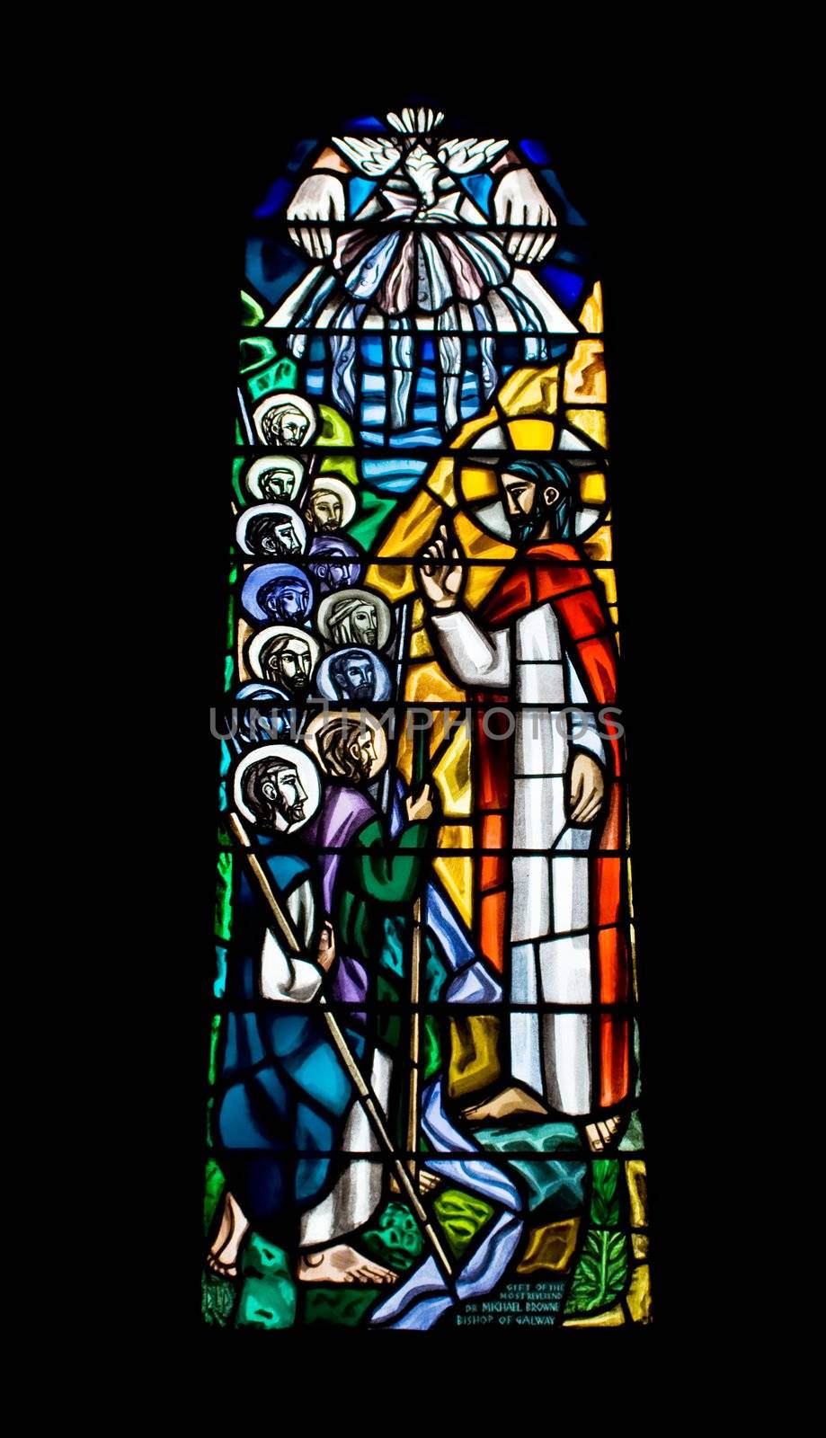 A religious stained glass window inside a church. The church is The Cathedral of Our Lady Assumed into Heaven and St Nicholas in Galway City, Ireland.