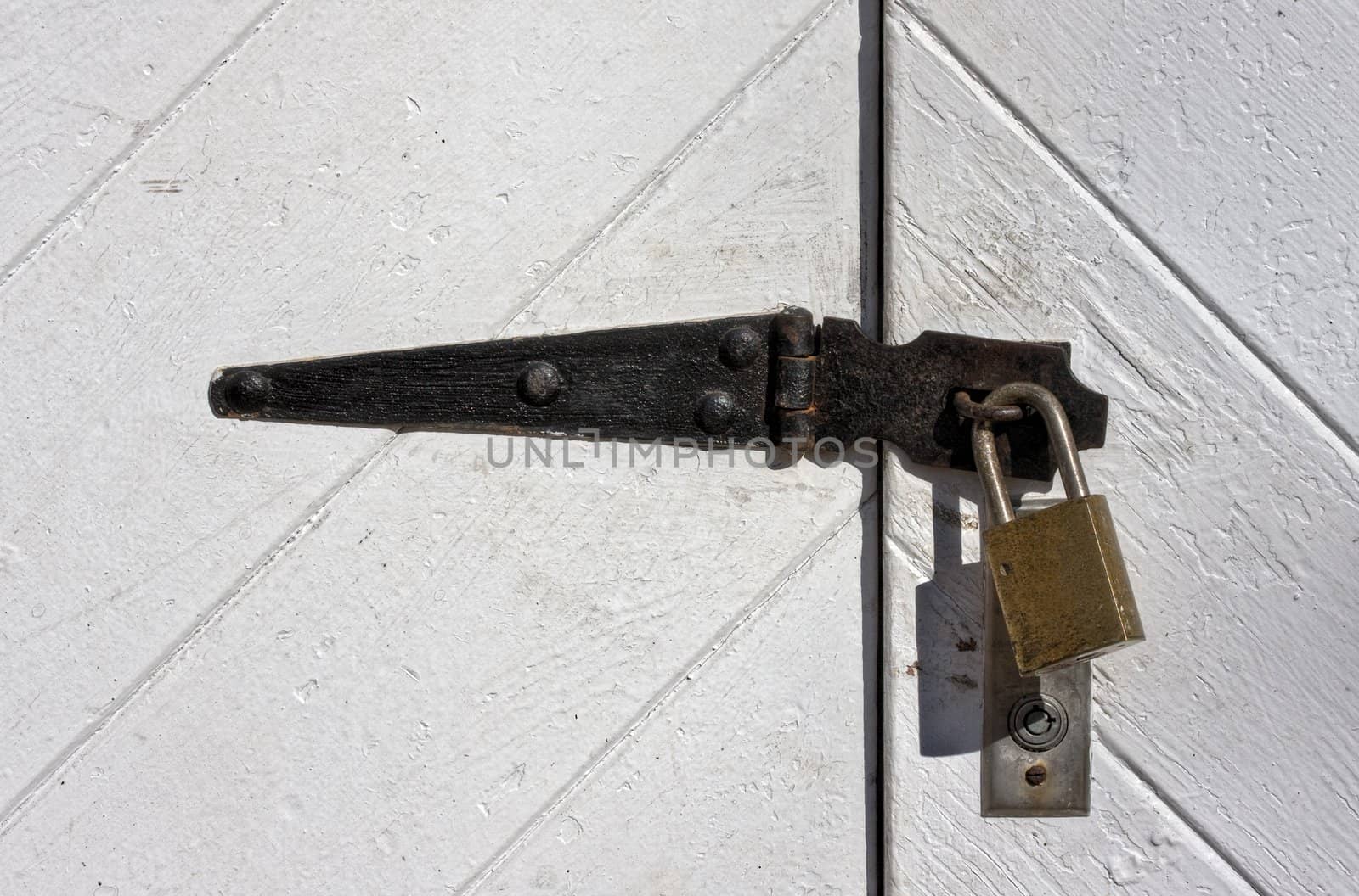 A locked padlock on old doors