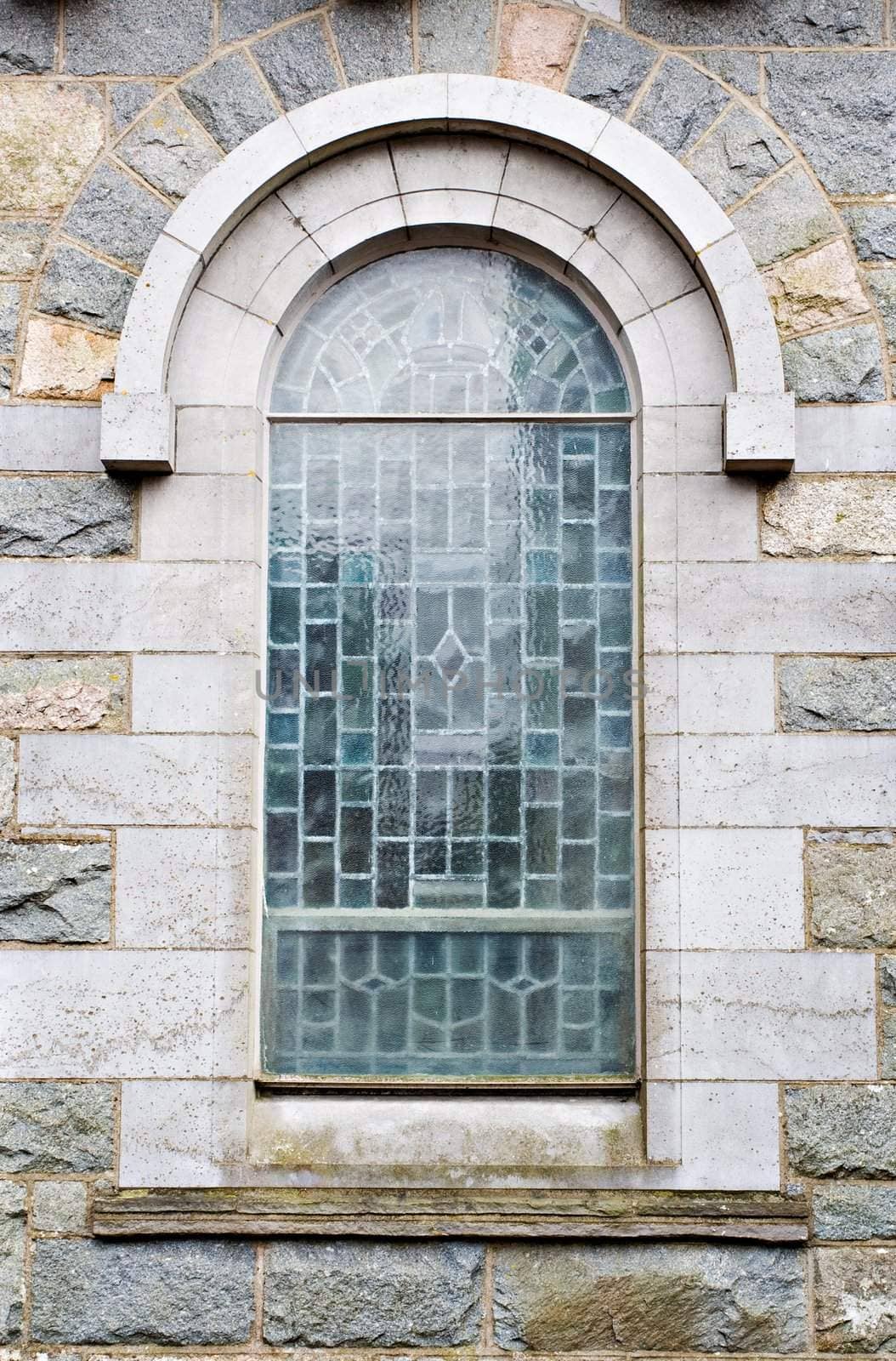 An old church window showing much detail and texture