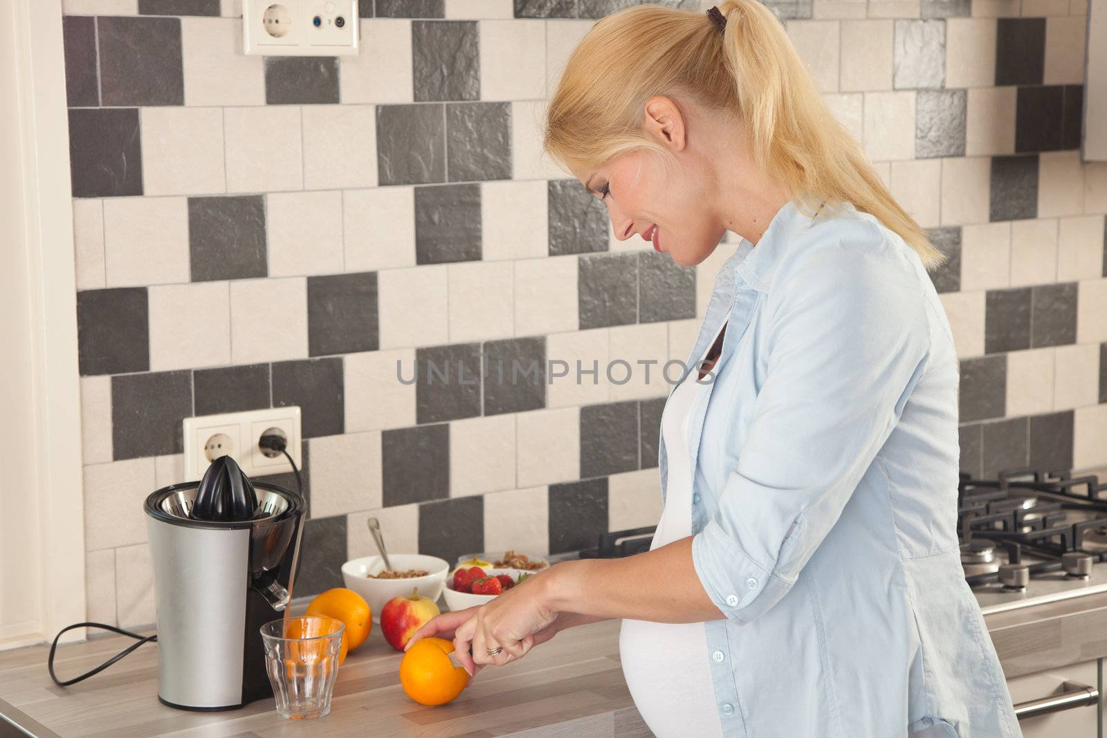 Beautiful woman expecting a child and eating healthy
