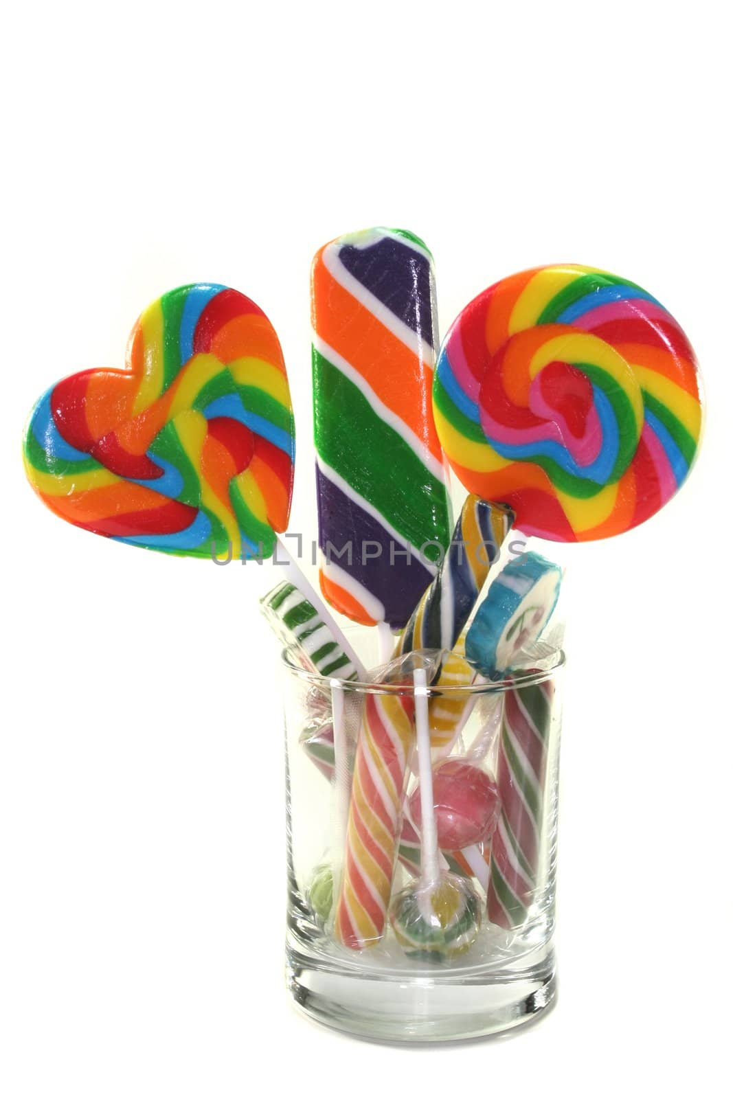 many colorful lollipops in a jar