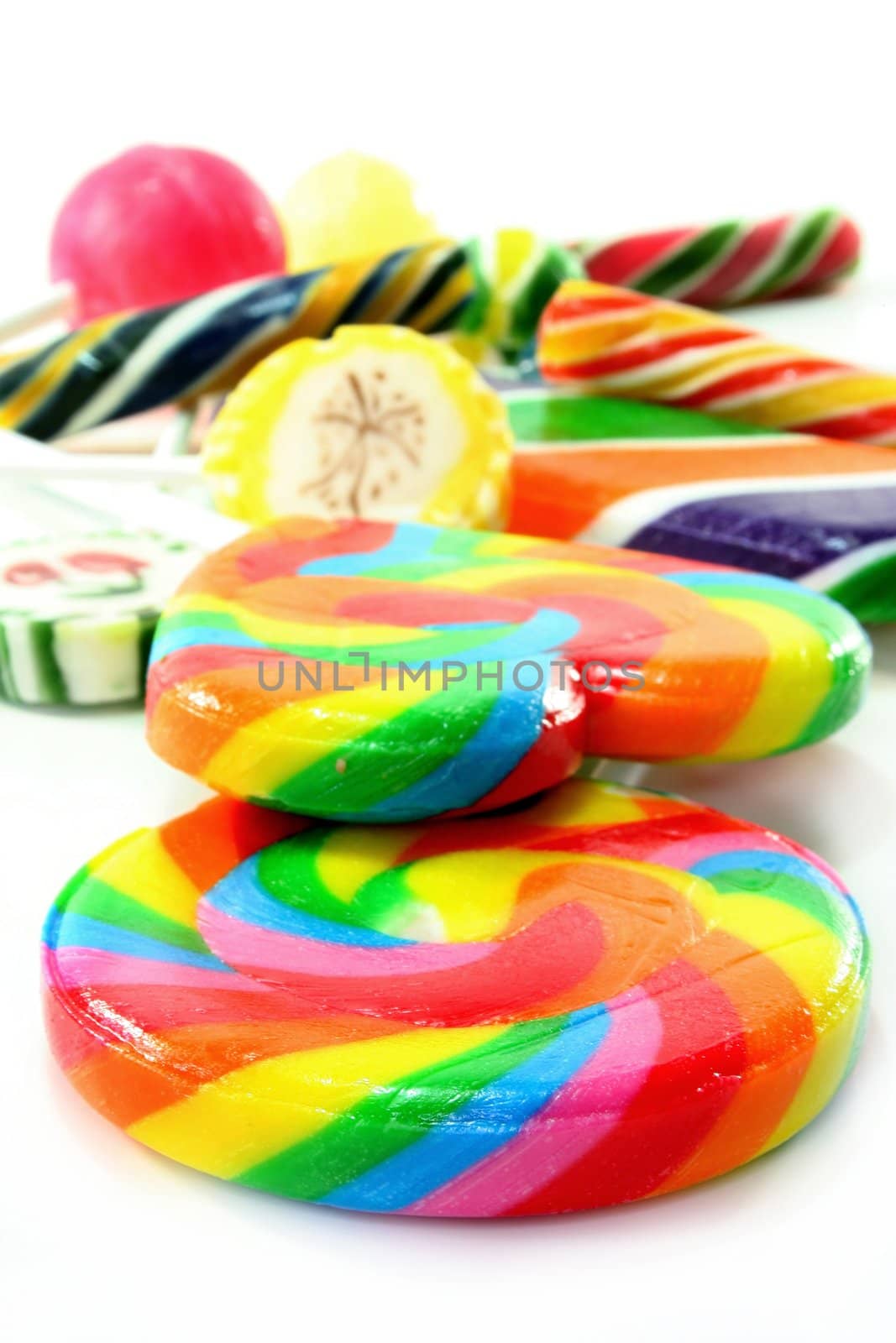 many colorful lollipop on a white background