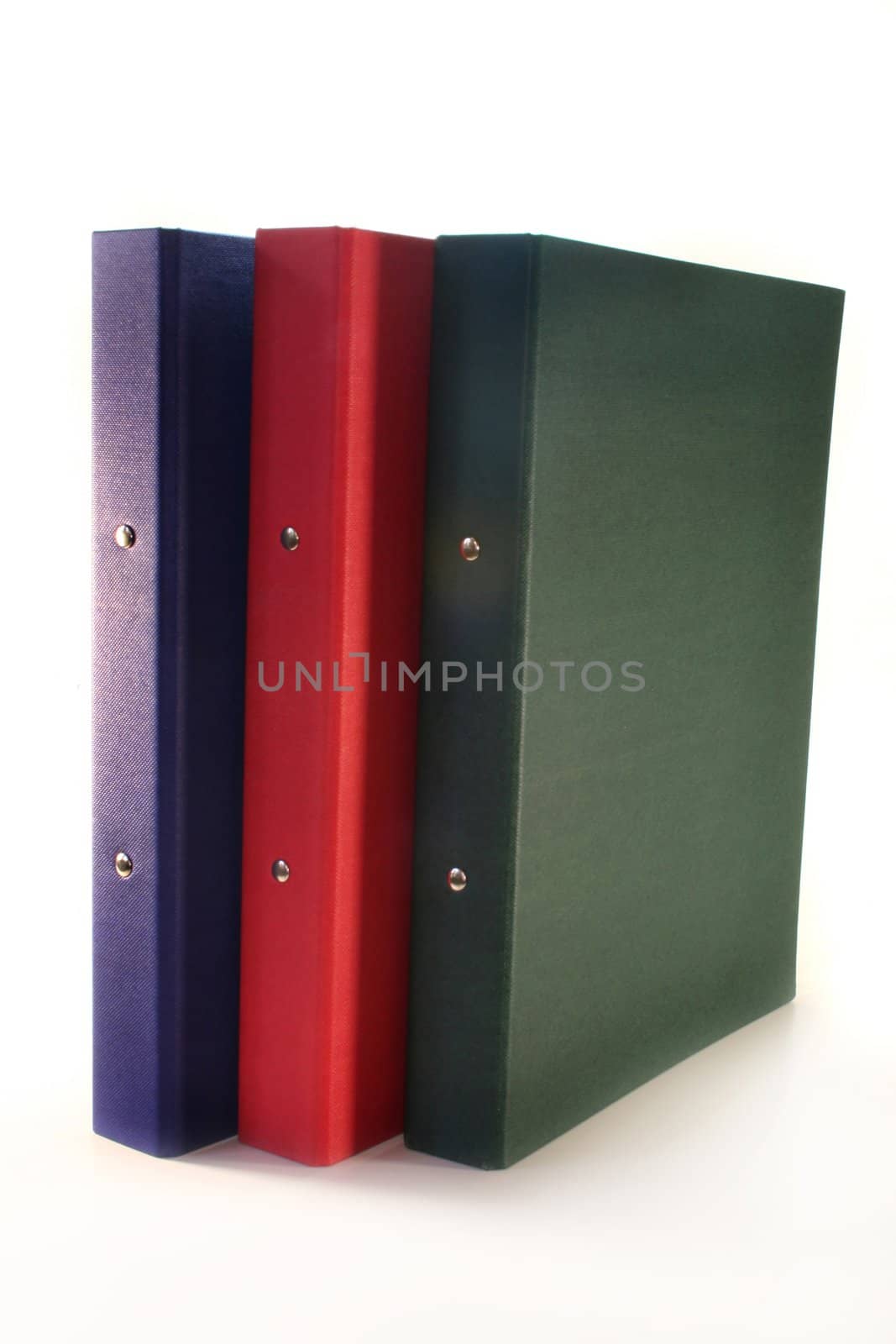three colored folders on a white background