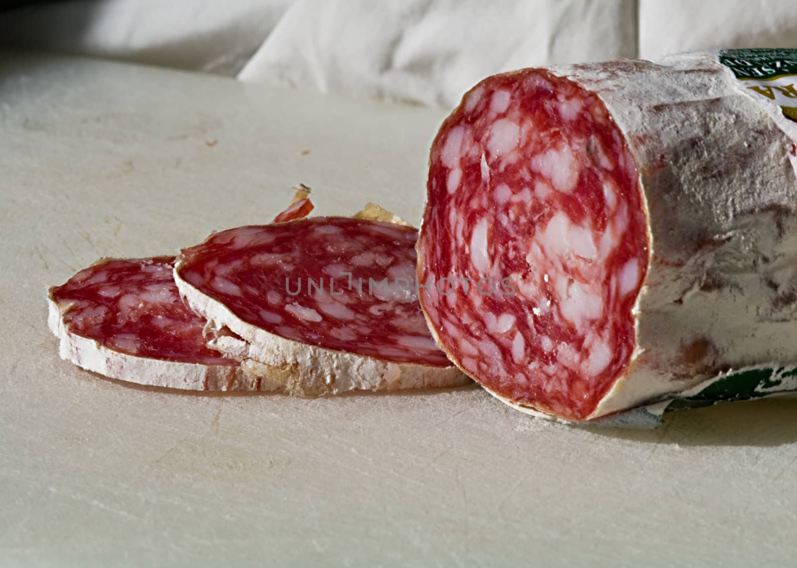 Pieces of salami sliced for being eaten