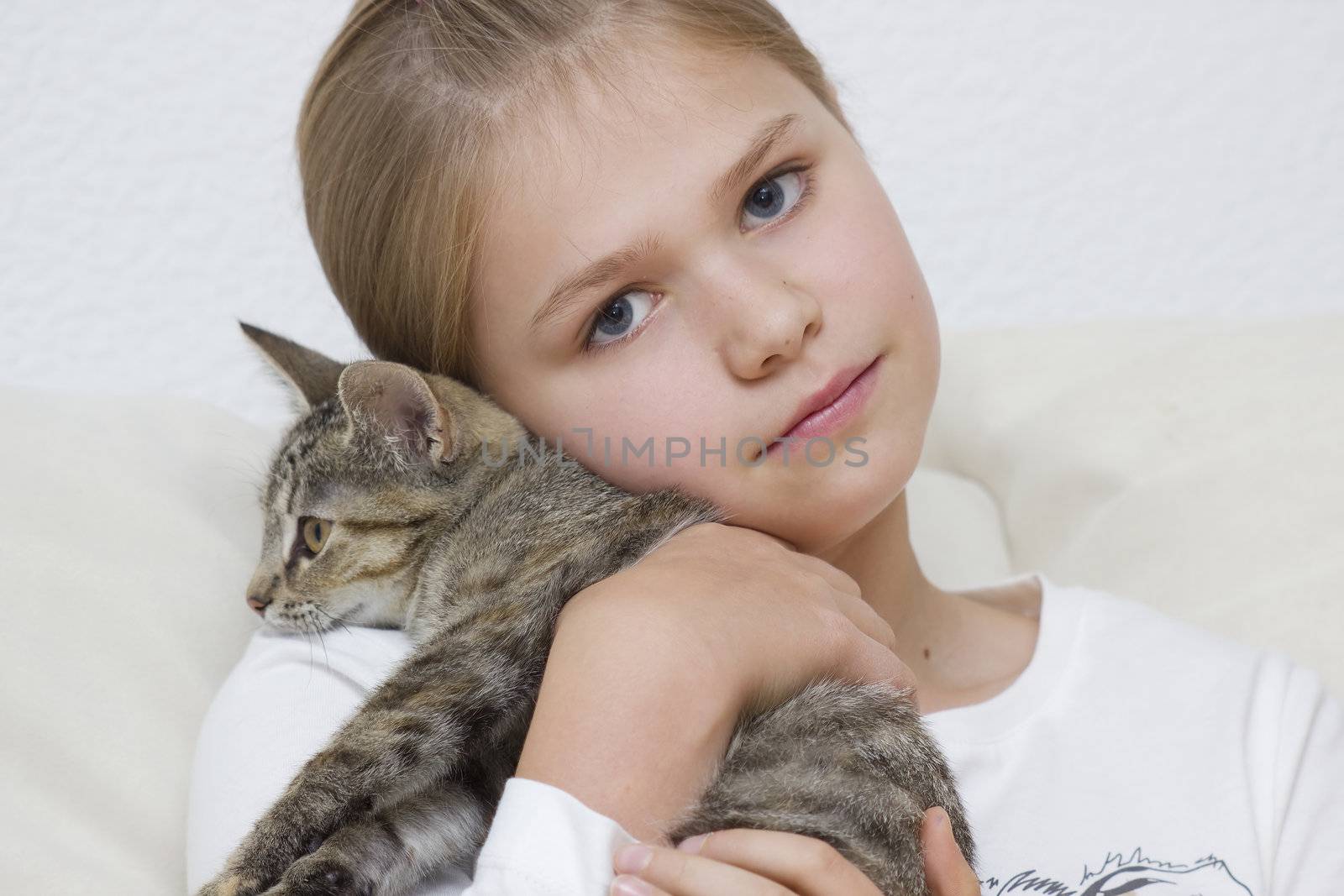 Portrait of child with kitten by miradrozdowski
