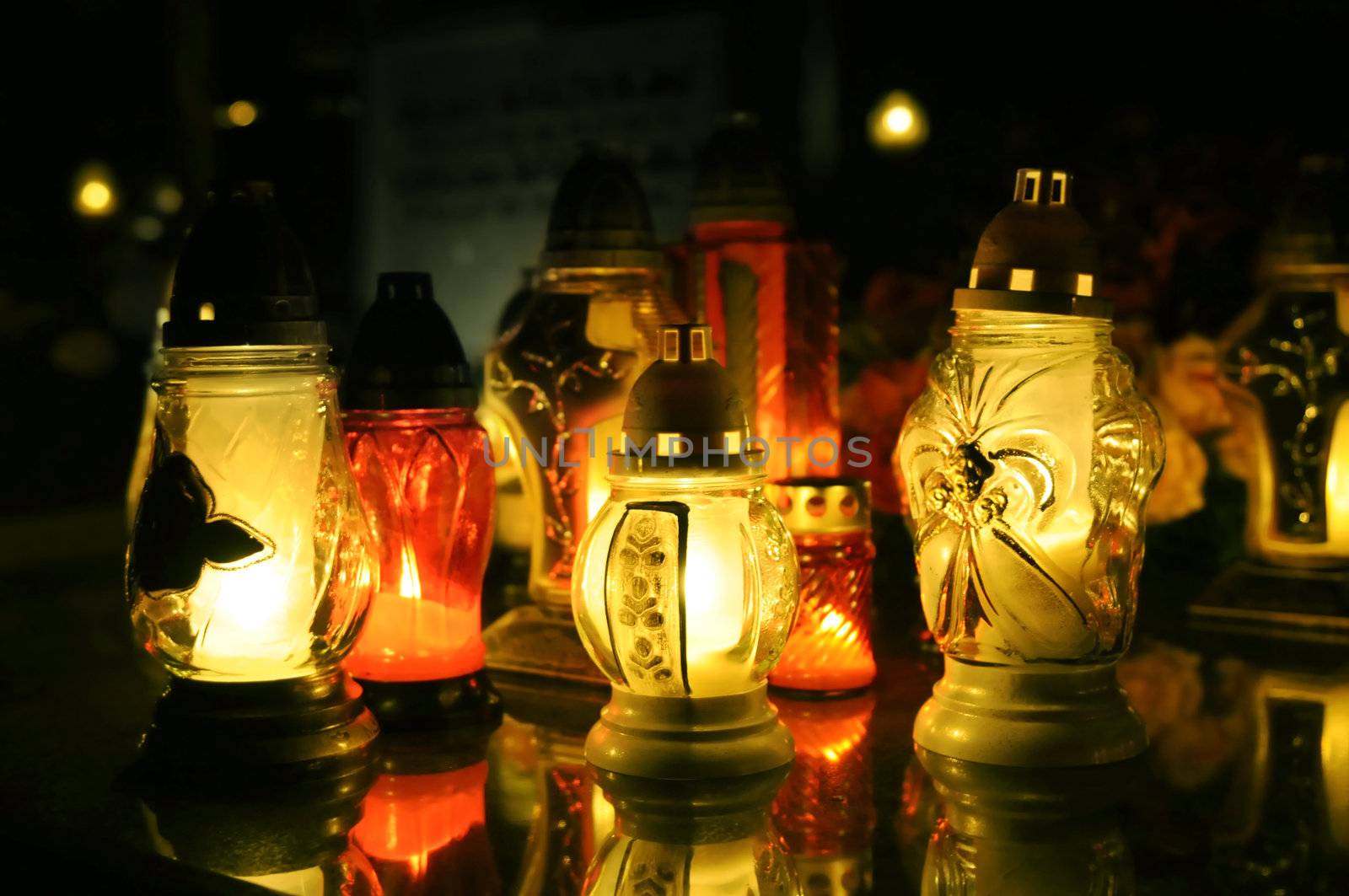 Candles on a grave at night