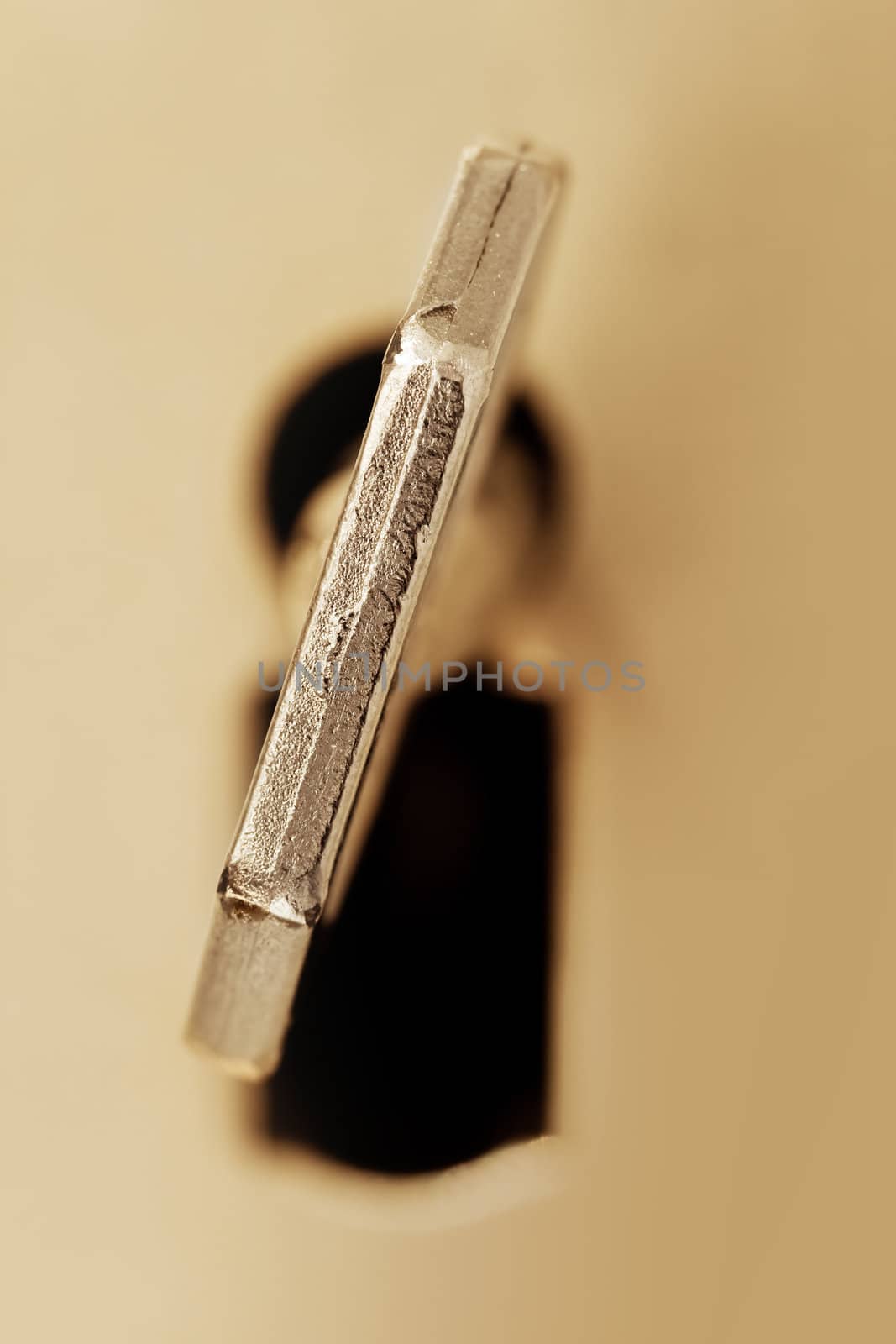 Key in a keyhole , close up retro style toned photo with space for your text