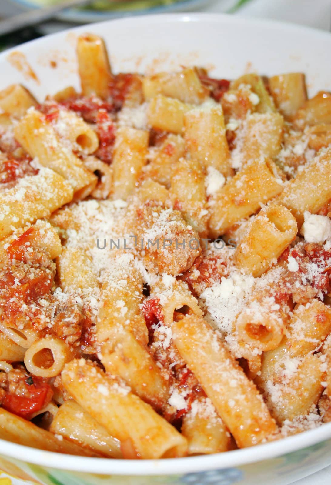pasta with bolognese sauce with tomatoes, meat and parmesan cheese 