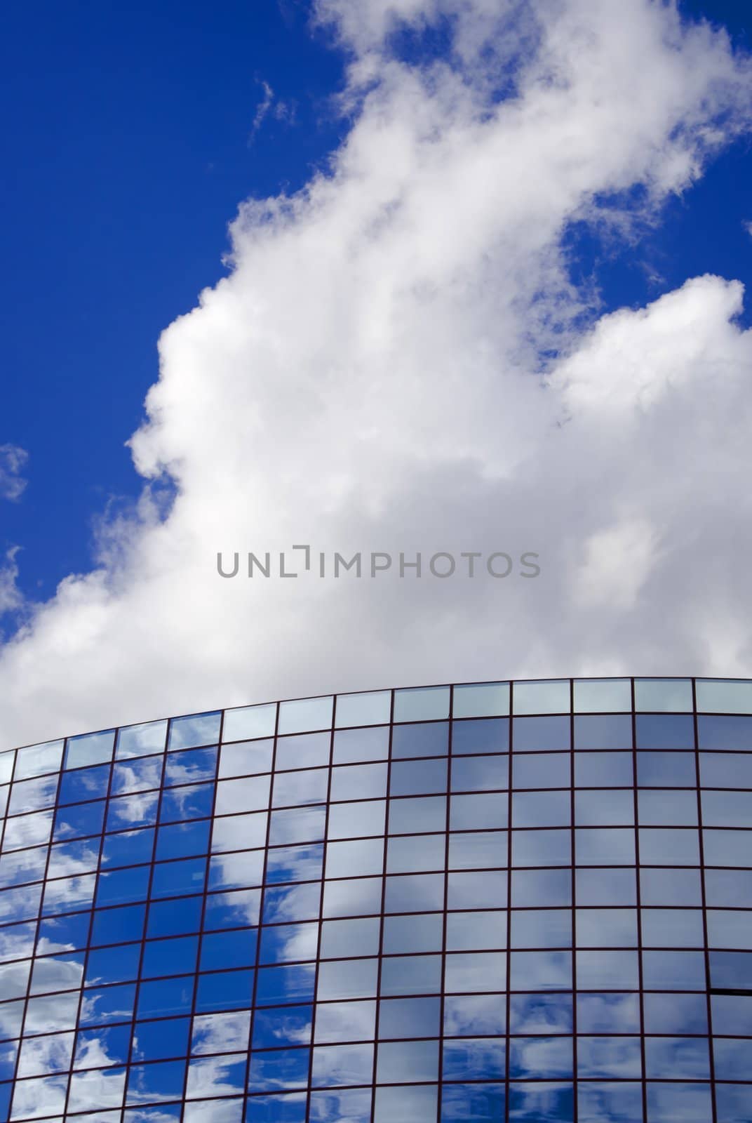 Modern office building and cloudy sky